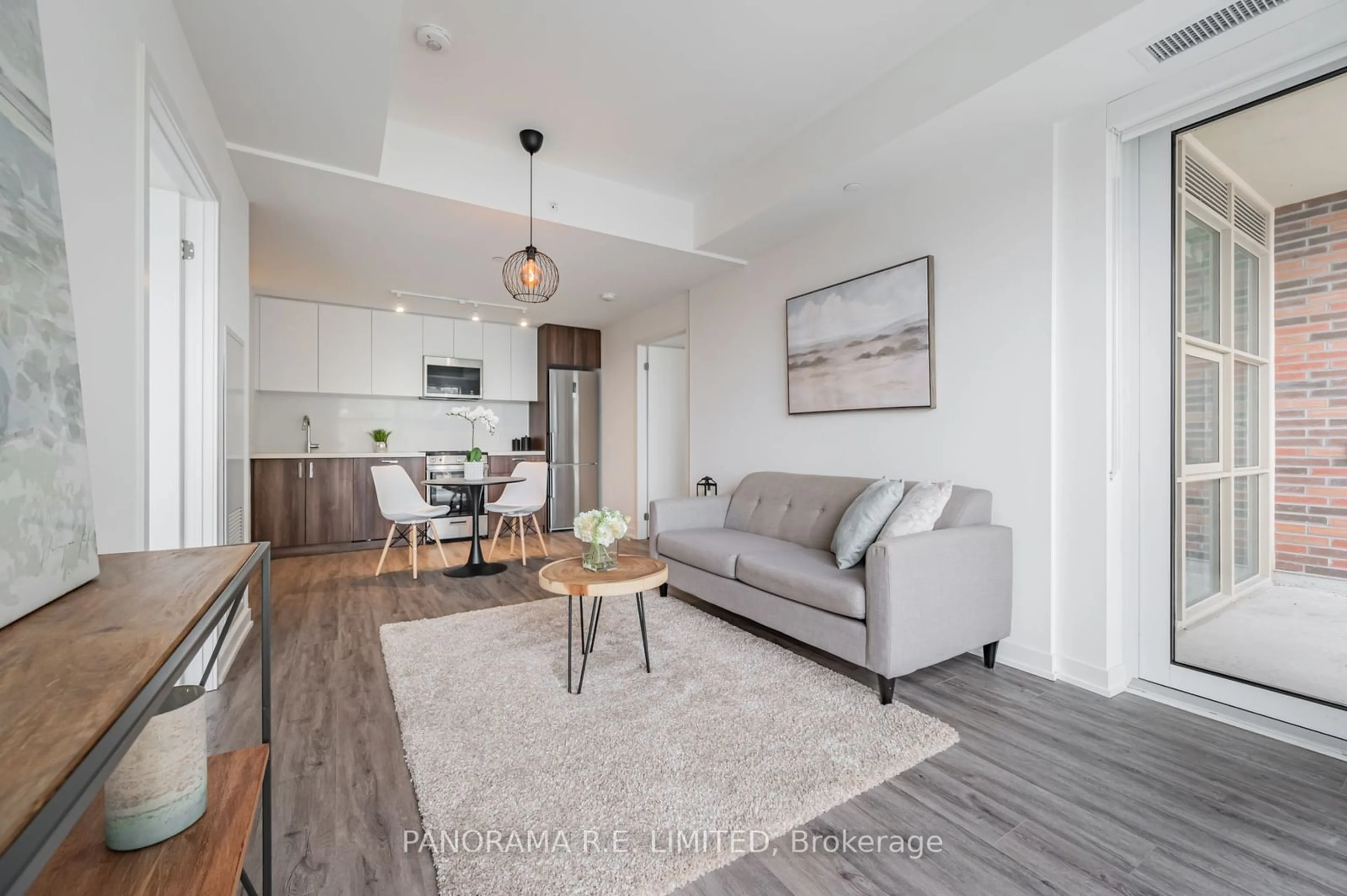 Living room with furniture, wood/laminate floor for 1787 St Clair Ave #705, Toronto Ontario M6N 1J6