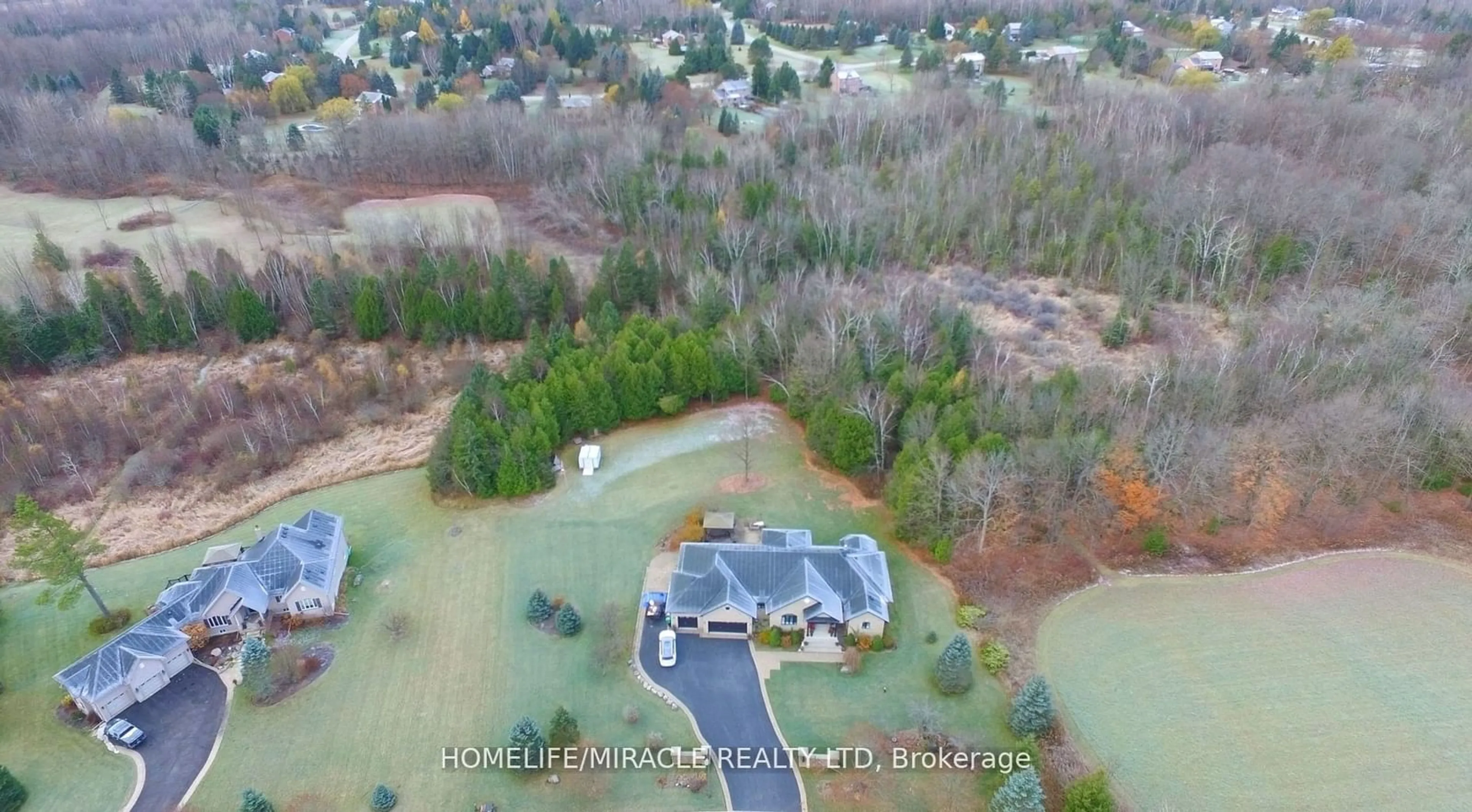 A pic from outside/outdoor area/front of a property/back of a property/a pic from drone, water/lake/river/ocean view for 15 Rolling Meadow Dr, Caledon Ontario L7K 0N2