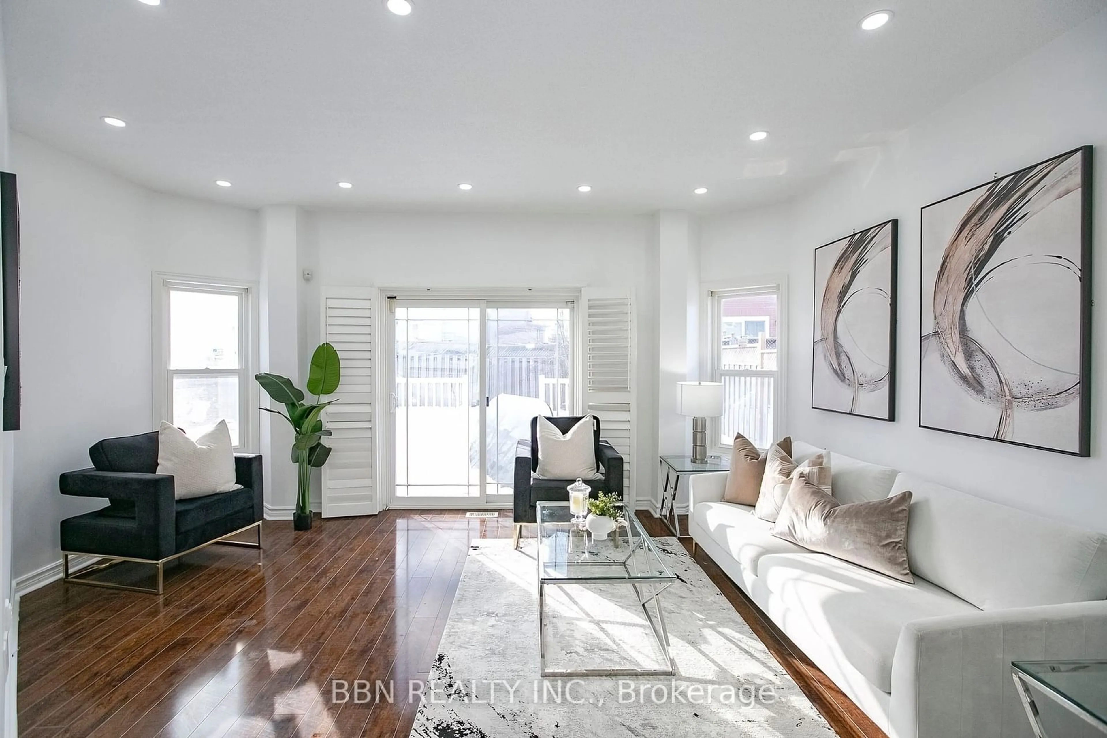 Living room with furniture, wood/laminate floor for 192 Drinkwater Rd, Brampton Ontario L6Y 4Z6