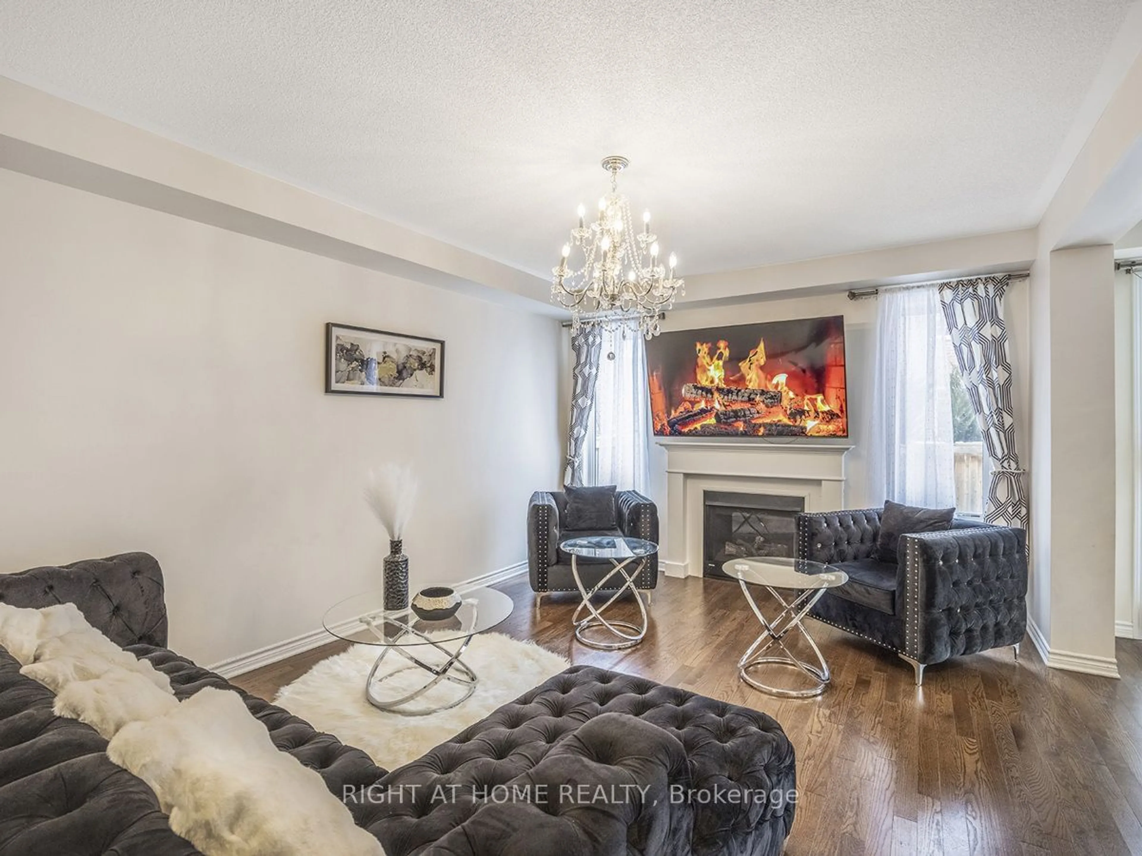 Living room with furniture, wood/laminate floor for 653 Langholm St, Milton Ontario L9T 8Z8