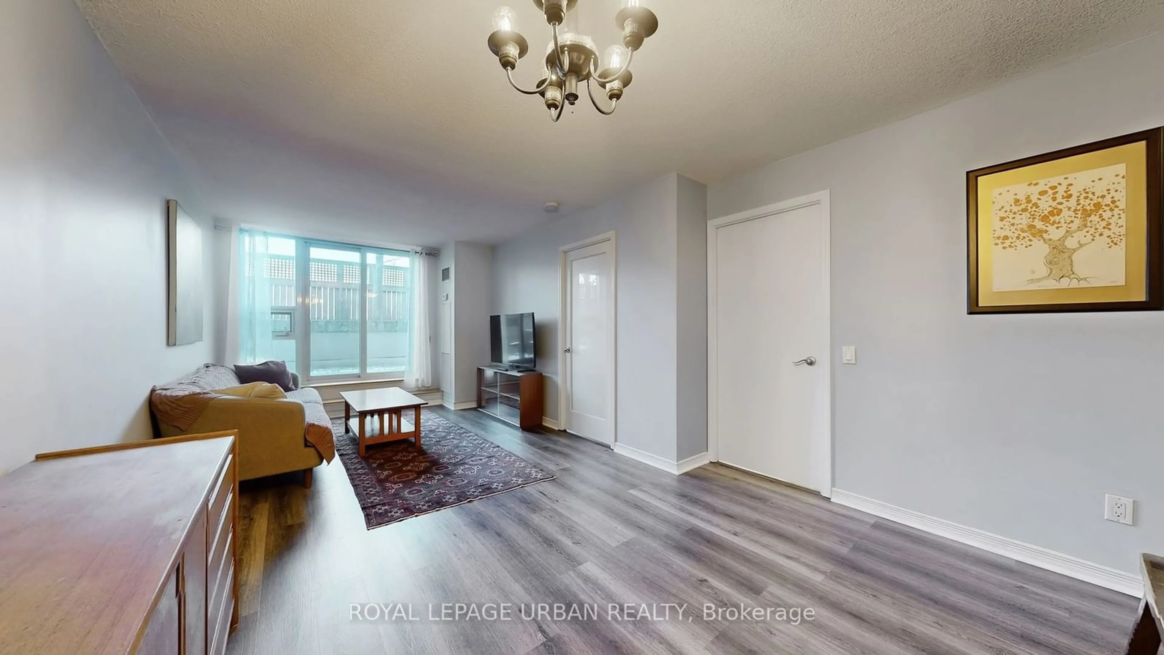 Living room with furniture, wood/laminate floor for 60 Heintzman St #428, Toronto Ontario M6P 5A1