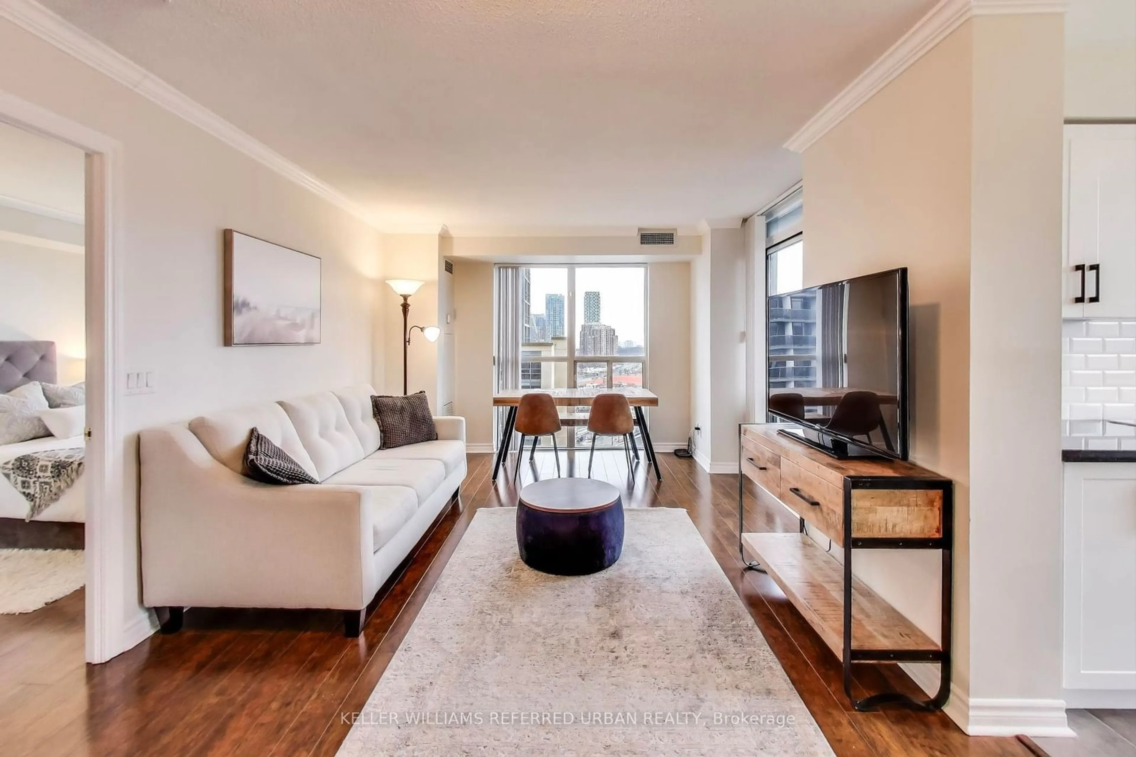 Living room with furniture, wood/laminate floor for 5 Michael Power Pl #1807, Toronto Ontario M9A 0A3