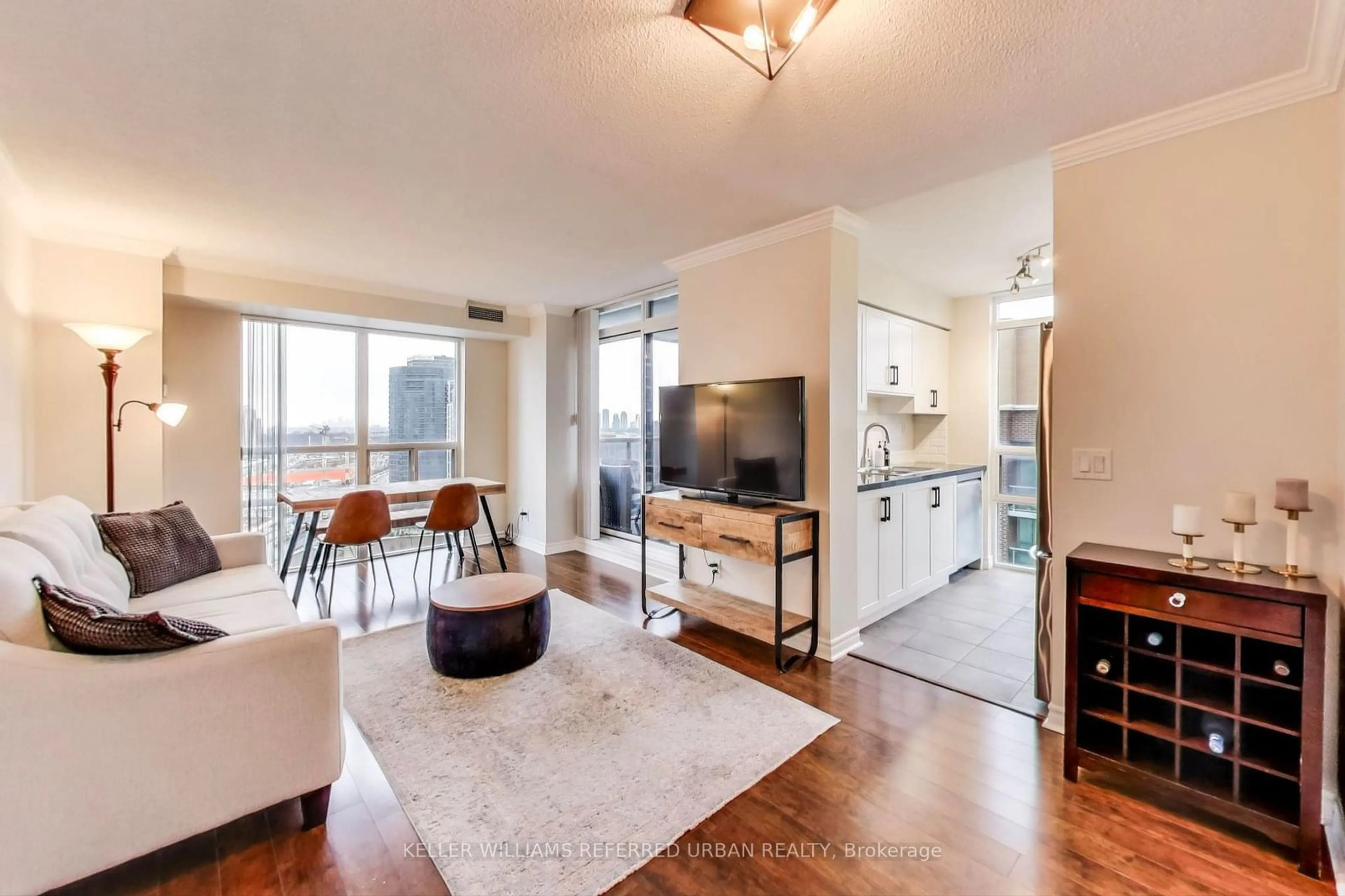 Living room with furniture, wood/laminate floor for 5 Michael Power Pl #1807, Toronto Ontario M9A 0A3