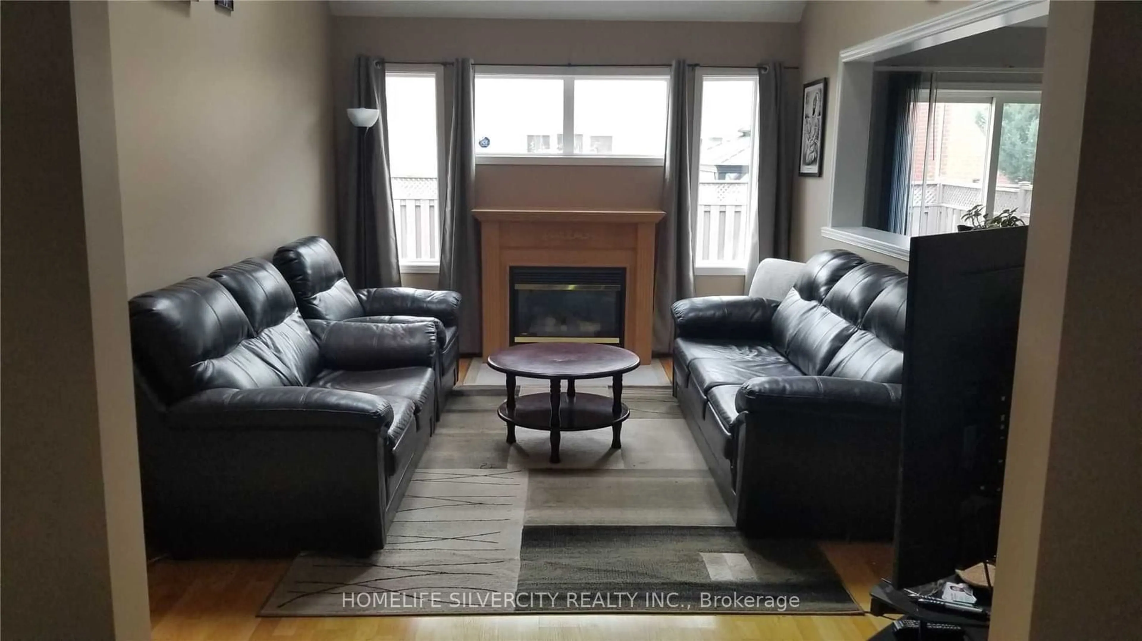 Living room with furniture, wood/laminate floor for 222 Edenbrook Hill Dr, Brampton Ontario L7A 2W7