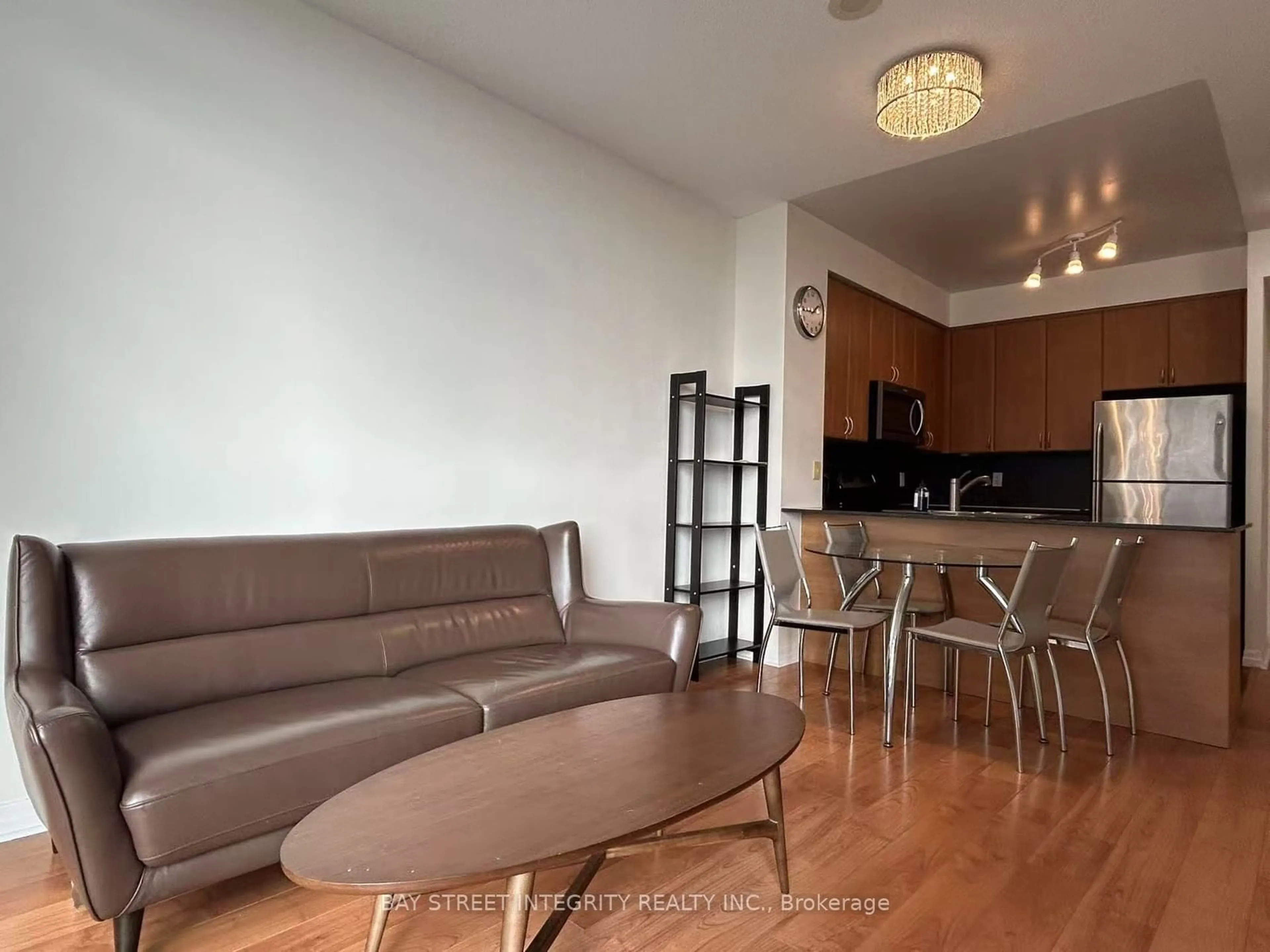 Living room with furniture, wood/laminate floor for 225 Webb Dr #1211, Mississauga Ontario L5B 4P2