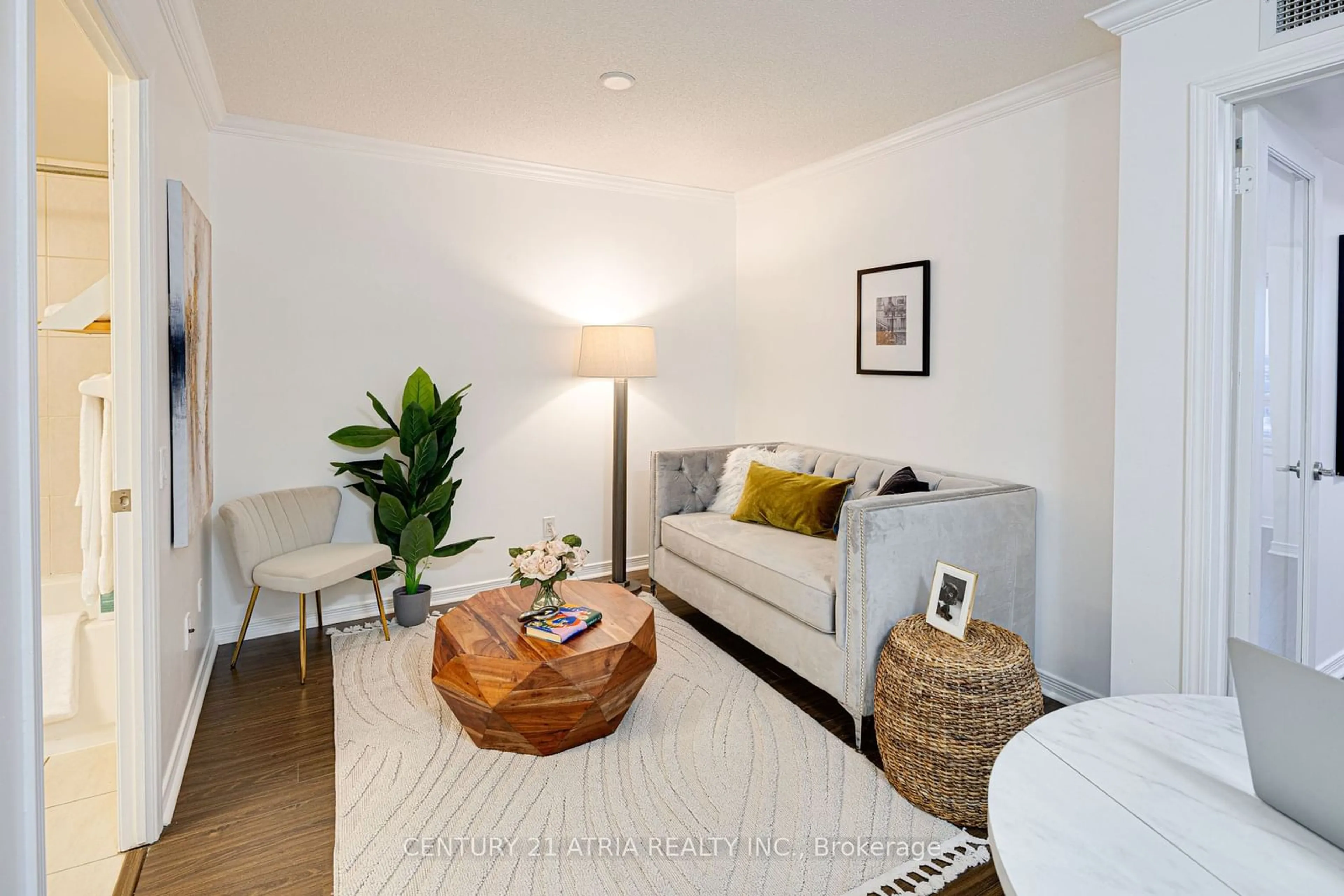 Living room with furniture, wood/laminate floor for 60 Heintzman St #1705, Toronto Ontario M6P 5A1