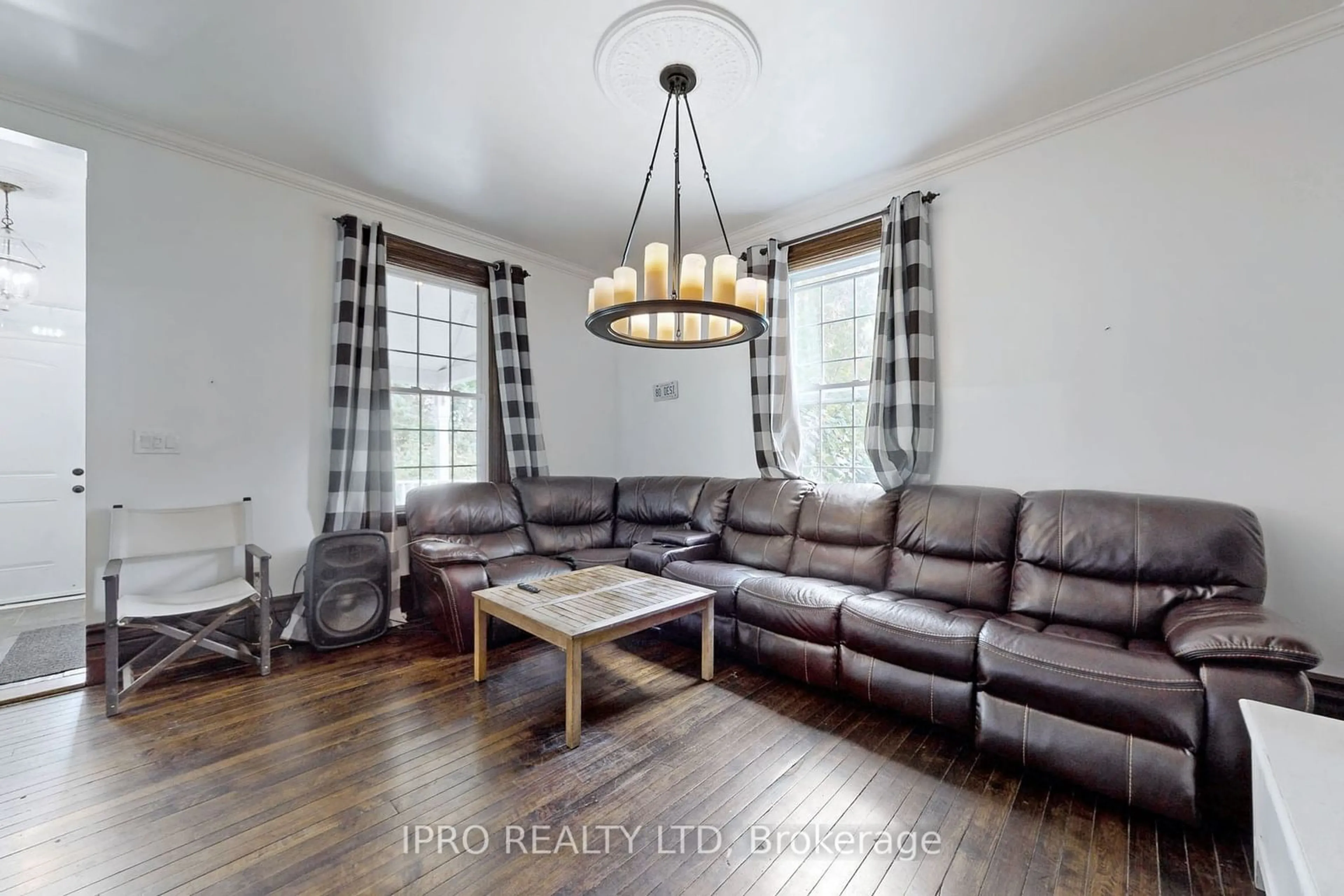 Living room with furniture, wood/laminate floor for 10948 Winston Churchill Blvd, Halton Hills Ontario L7G 4S7