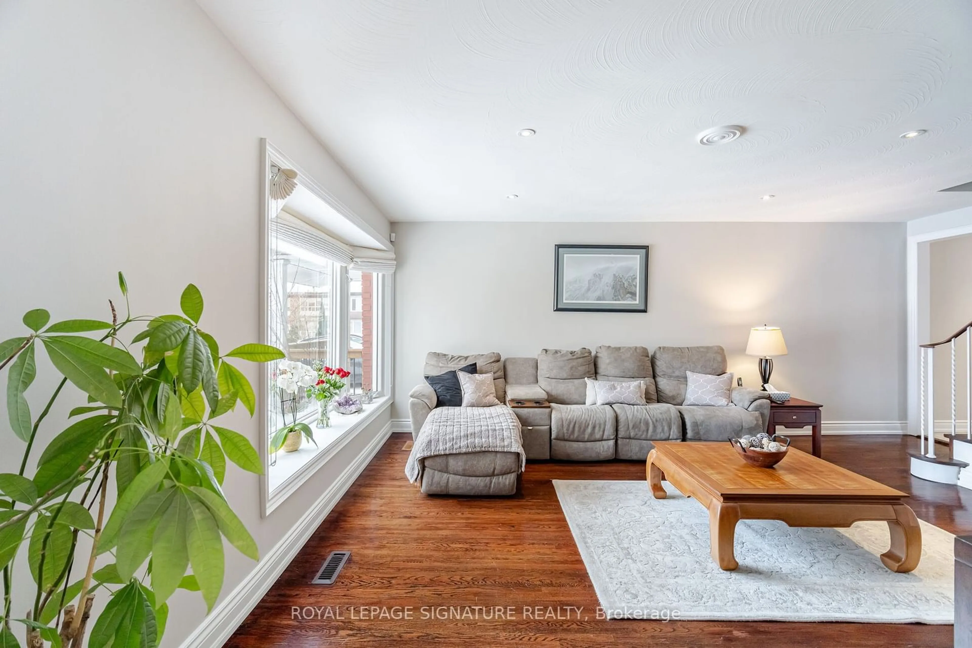 Living room with furniture, wood/laminate floor for 2392 Maryvale Crt, Burlington Ontario L7P 2P2