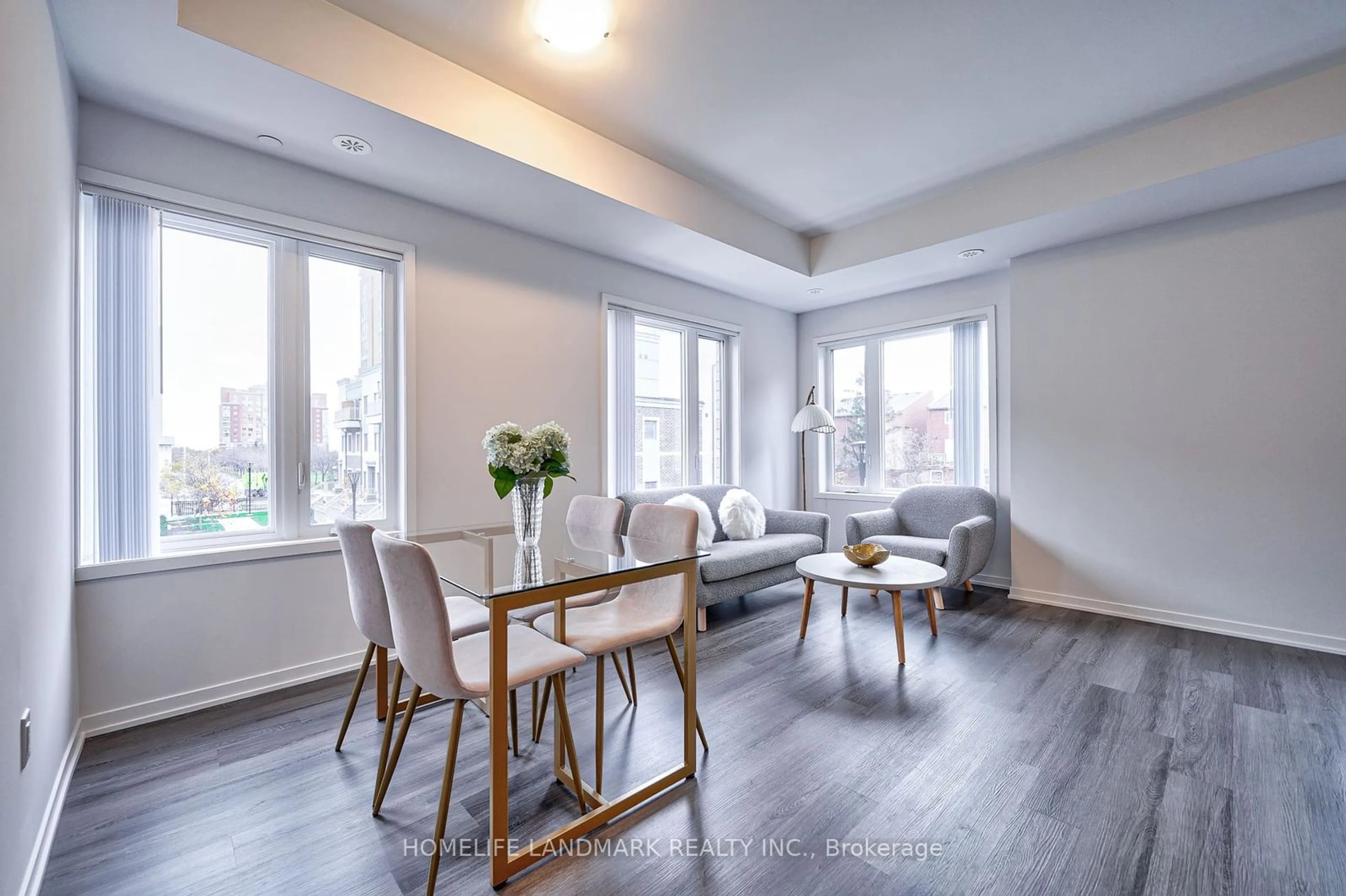 Living room with furniture, wood/laminate floor for 20 William Jackson Way #91, Toronto Ontario M8V 0J7