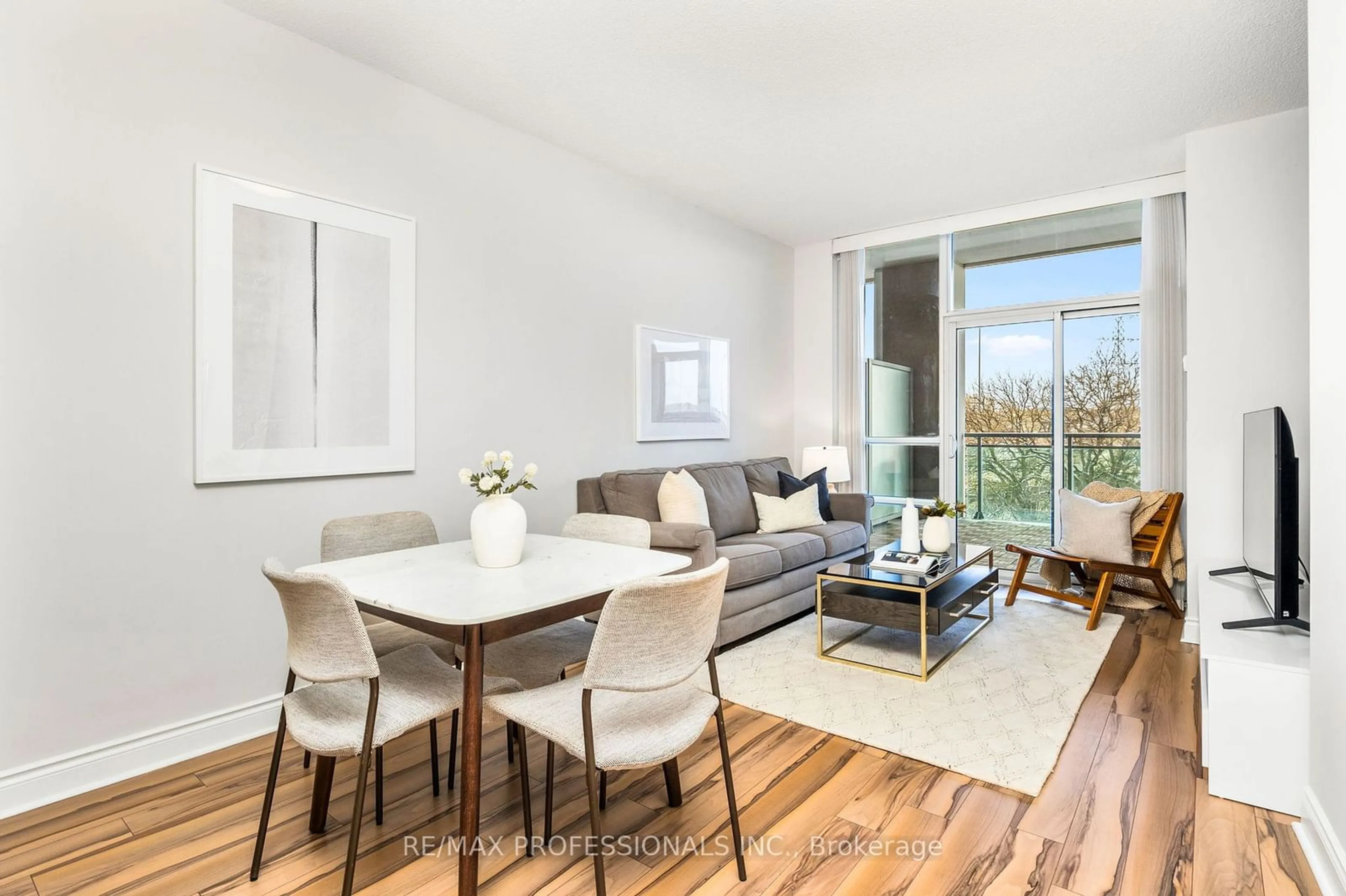 Living room with furniture, wood/laminate floor for 16 Brookers Lane #302, Toronto Ontario M8V 0A5