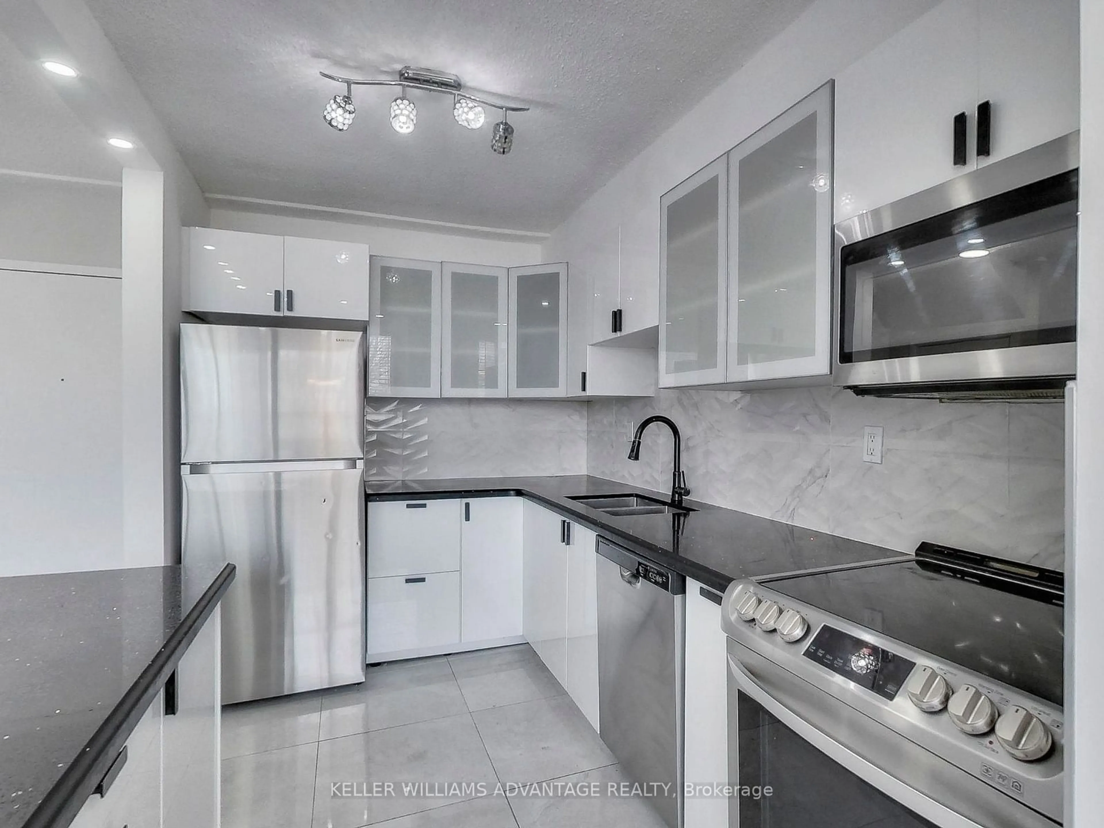 Standard kitchen, ceramic/tile floor for 1050 Stainton Dr #203, Mississauga Ontario L5C 2T7