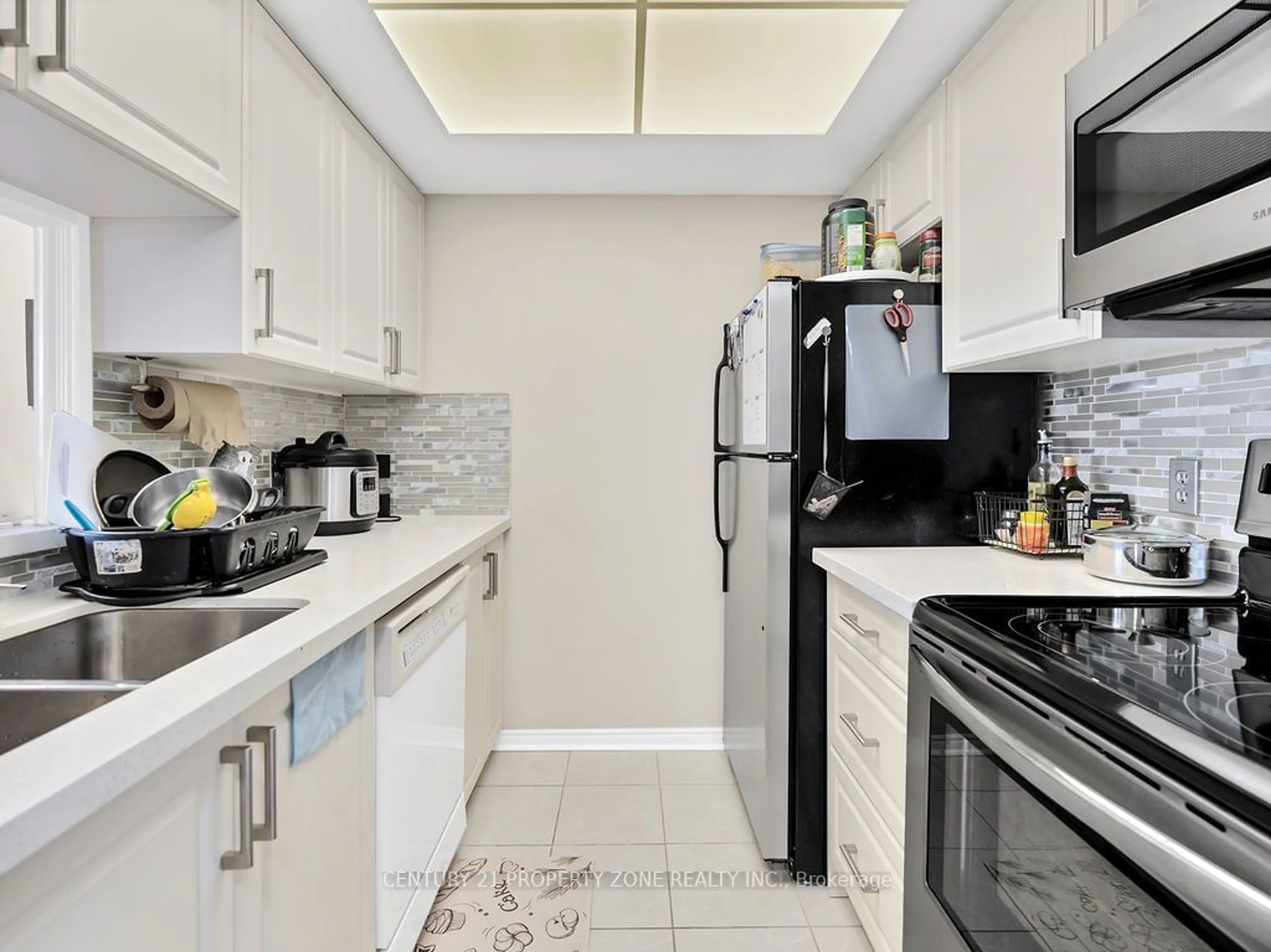 Standard kitchen, ceramic/tile floor for 8351 McLaughlin Rd #403, Brampton Ontario L6Y 4H8