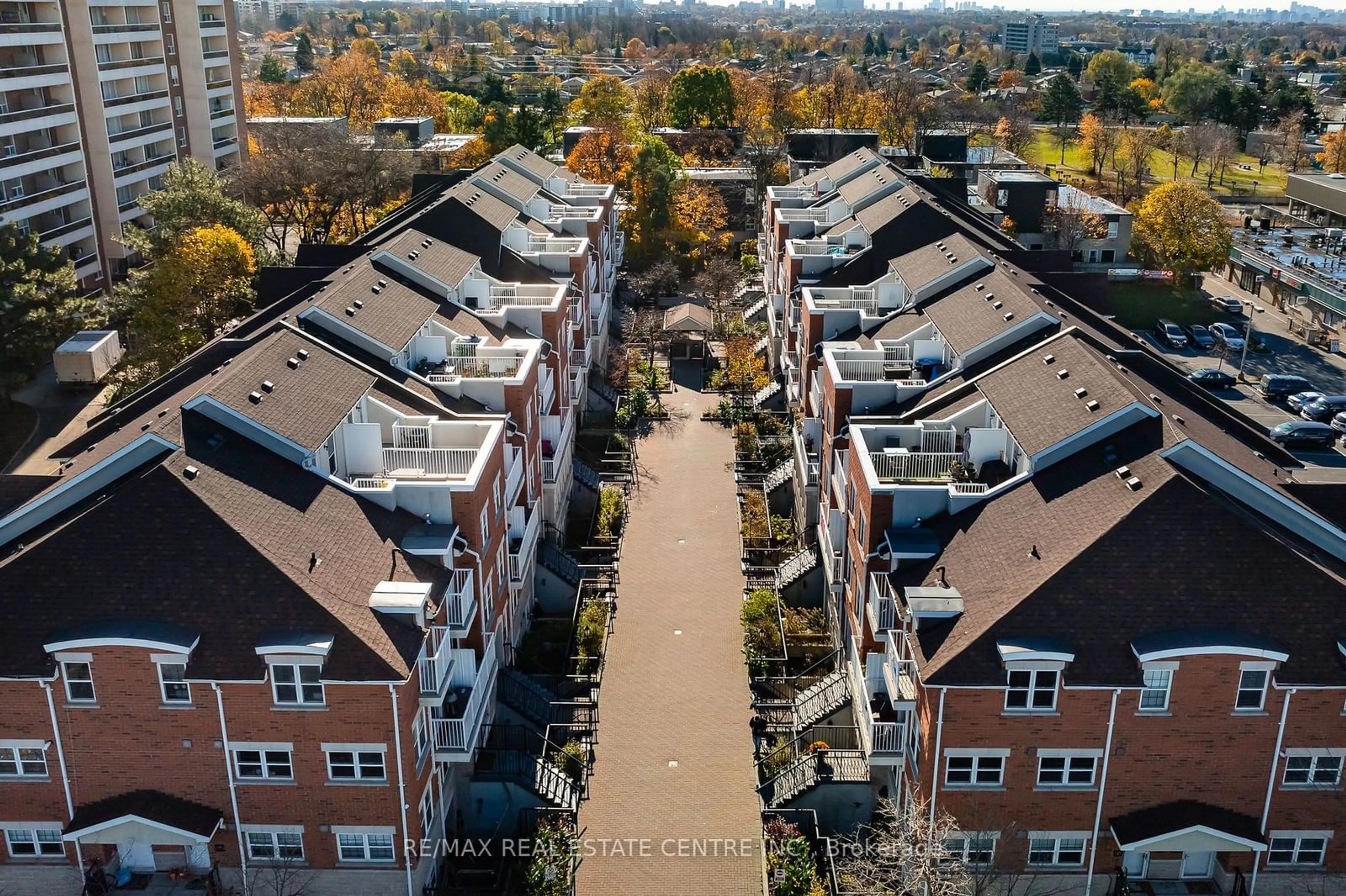 A pic from outside/outdoor area/front of a property/back of a property/a pic from drone, city buildings view from balcony for 37 Four Winds Dr #108, Toronto Ontario M3J 1K7