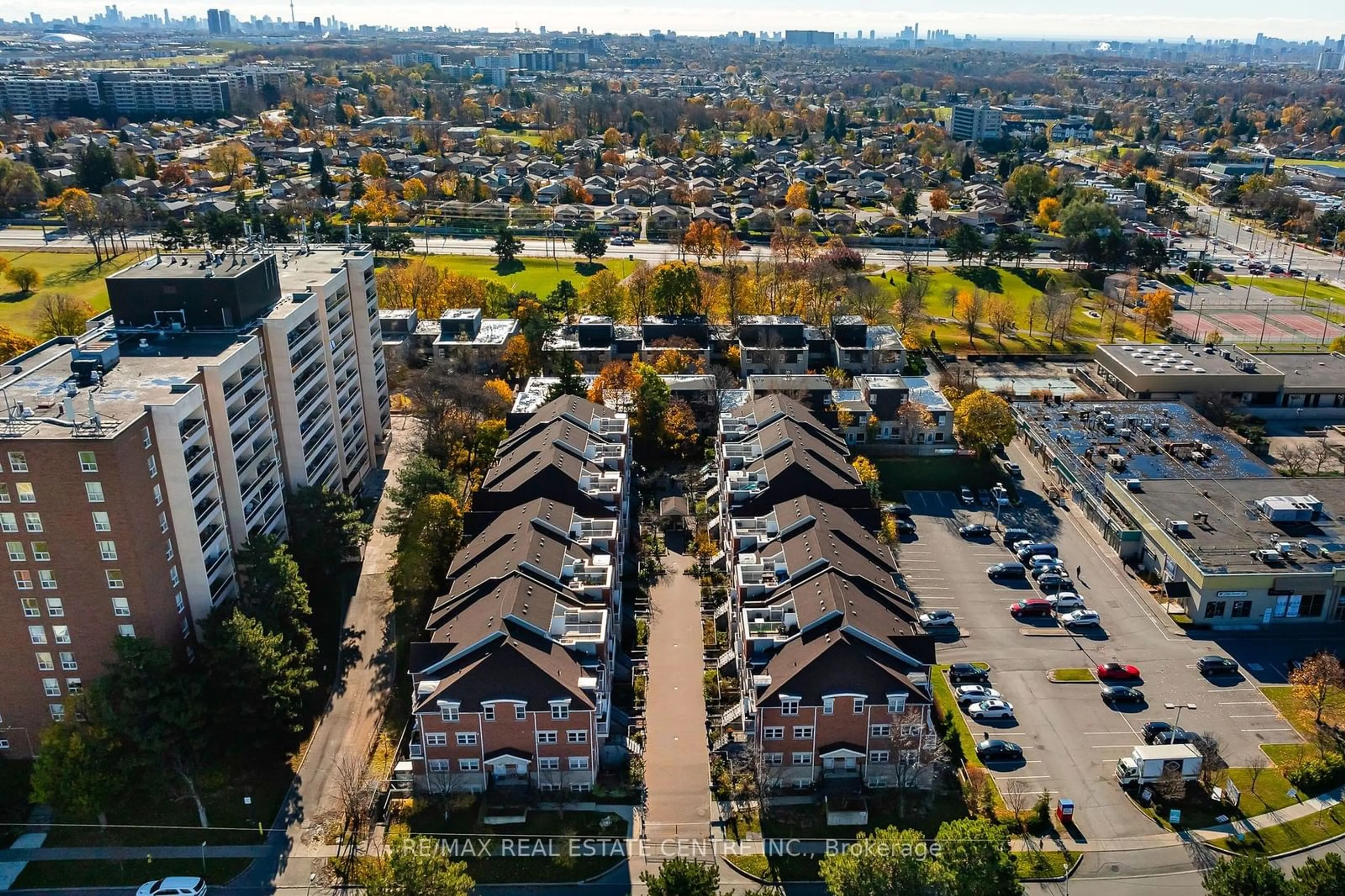 A pic from outside/outdoor area/front of a property/back of a property/a pic from drone, city buildings view from balcony for 37 Four Winds Dr #108, Toronto Ontario M3J 1K7