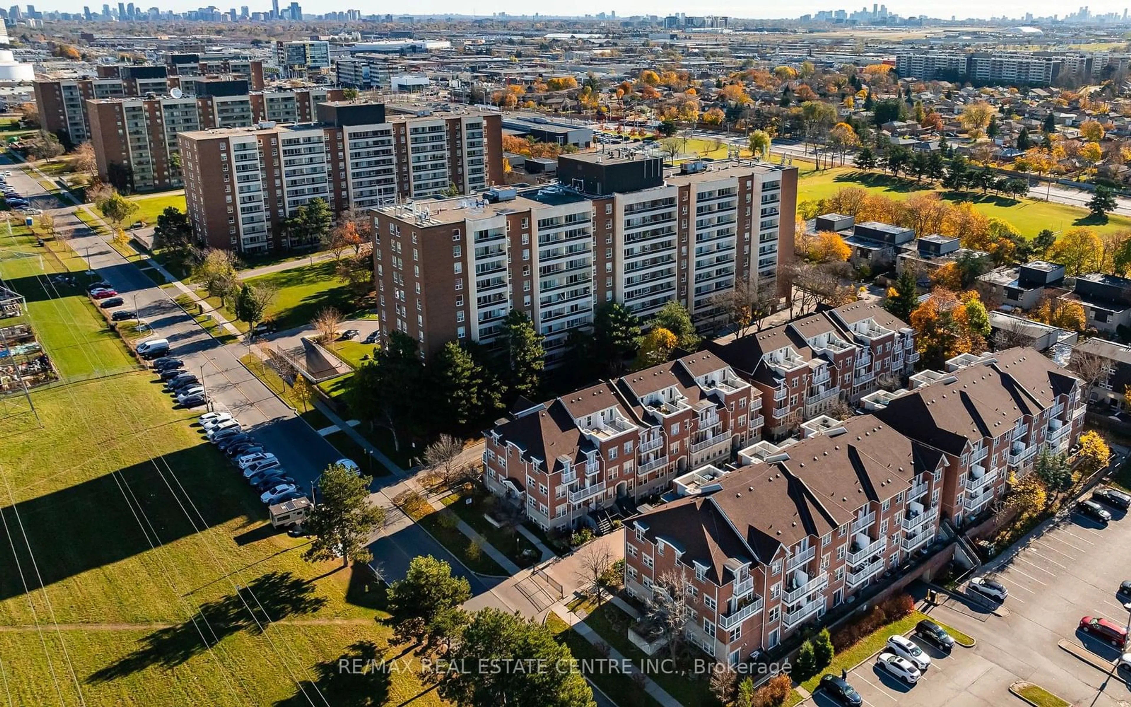 A pic from outside/outdoor area/front of a property/back of a property/a pic from drone, city buildings view from balcony for 37 Four Winds Dr #108, Toronto Ontario M3J 1K7