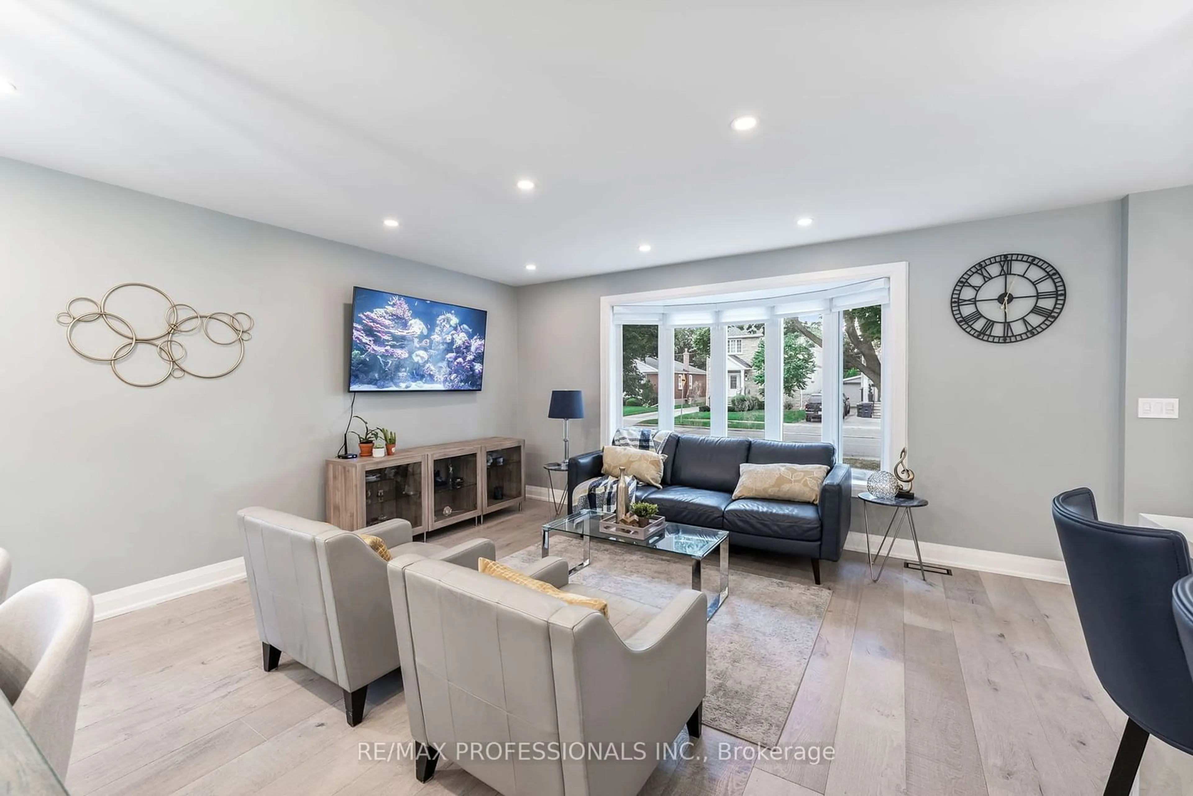 Living room with furniture, ceramic/tile floor for 27 Charleston Rd, Toronto Ontario M9B 4M6