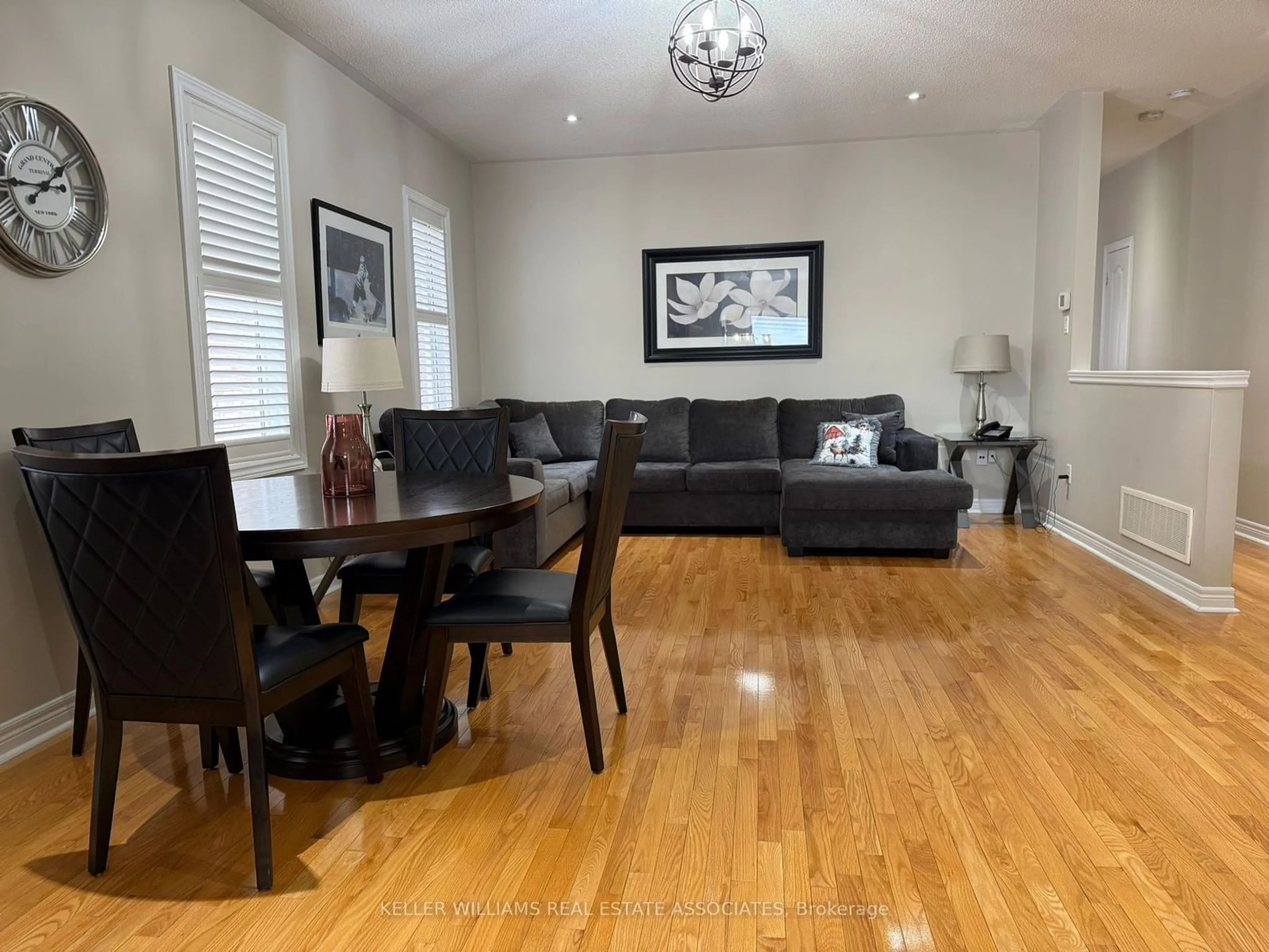 Living room with furniture, wood/laminate floor for 37 Chevrolet Dr, Brampton Ontario L7A 3C3