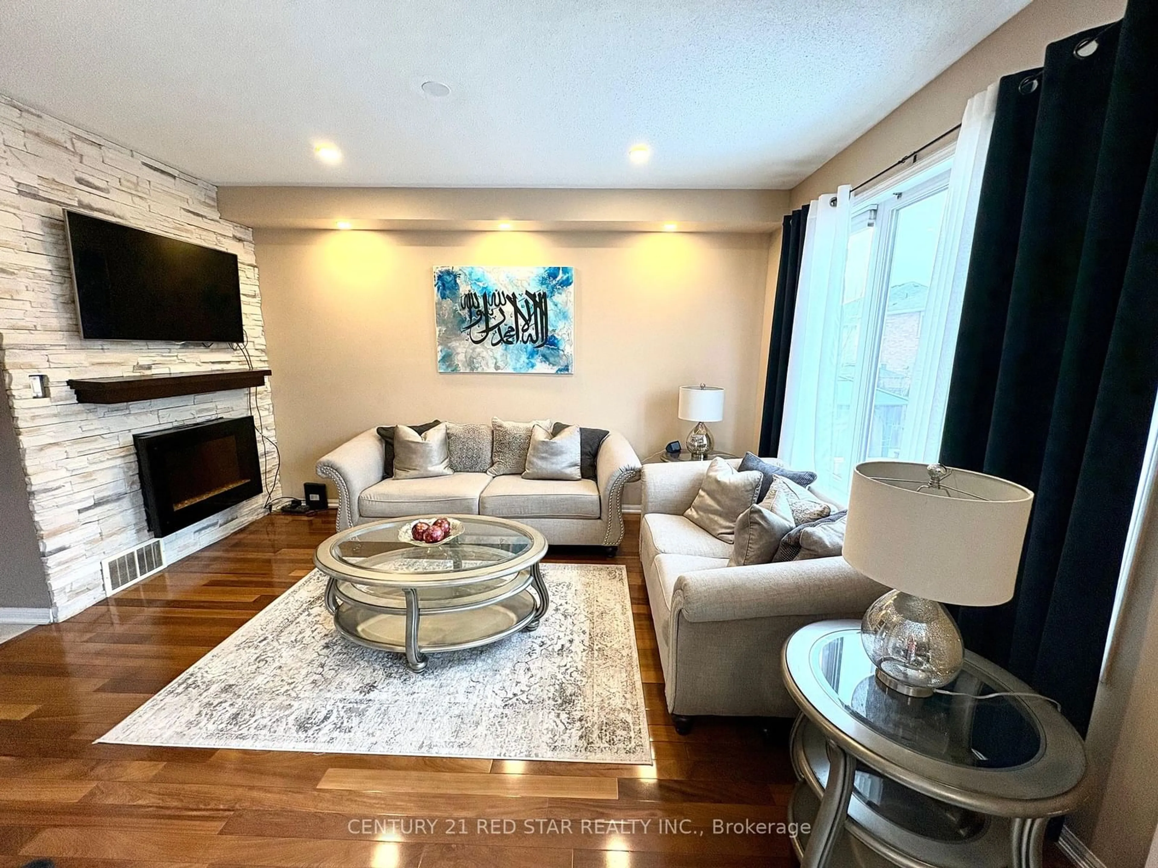 Living room with furniture, wood/laminate floor for 314 Jelinik Terr, Milton Ontario L9T 7M8