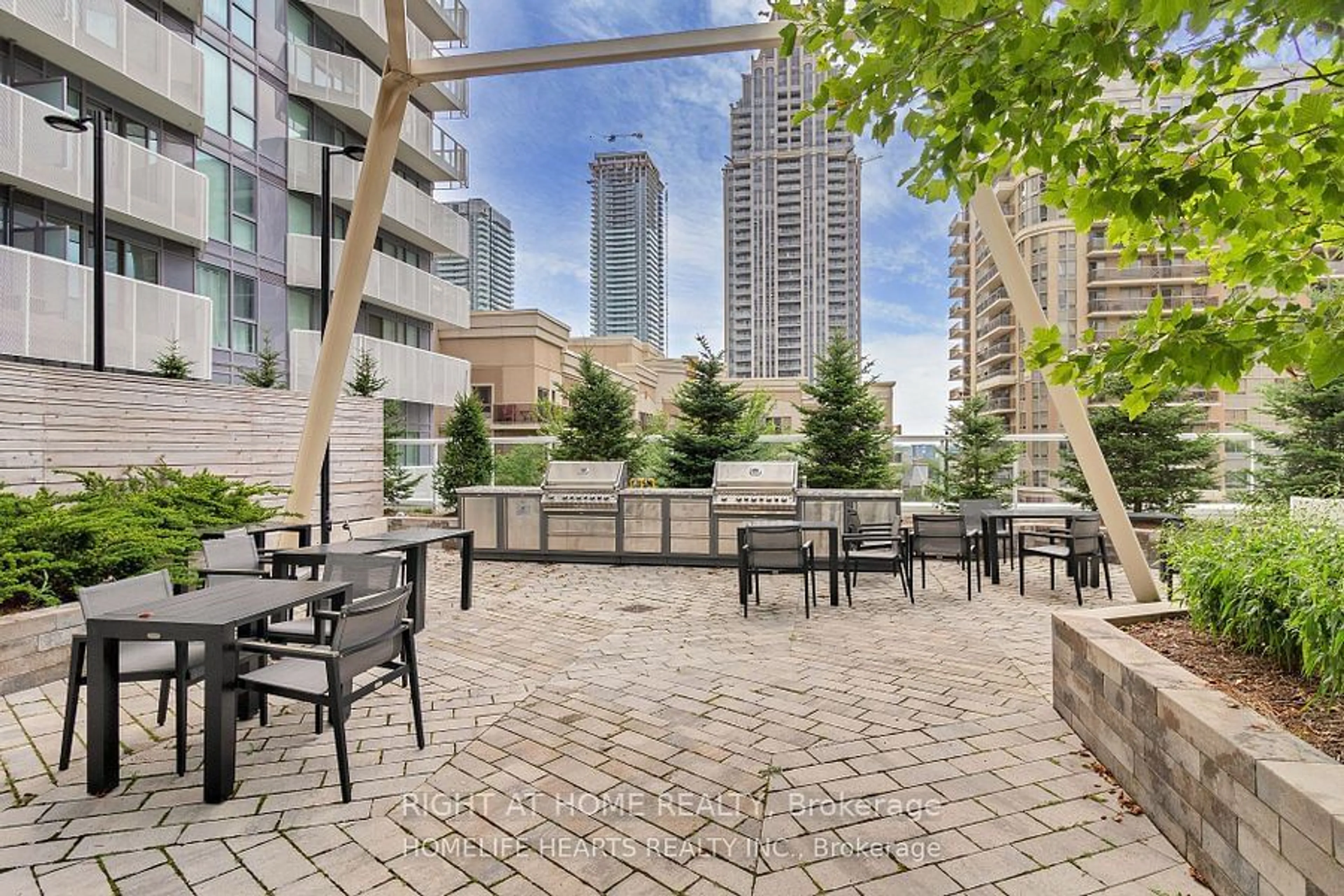 Patio, city buildings view from balcony for 4065 Confederation Pkwy #1008, Mississauga Ontario L5B 0L4