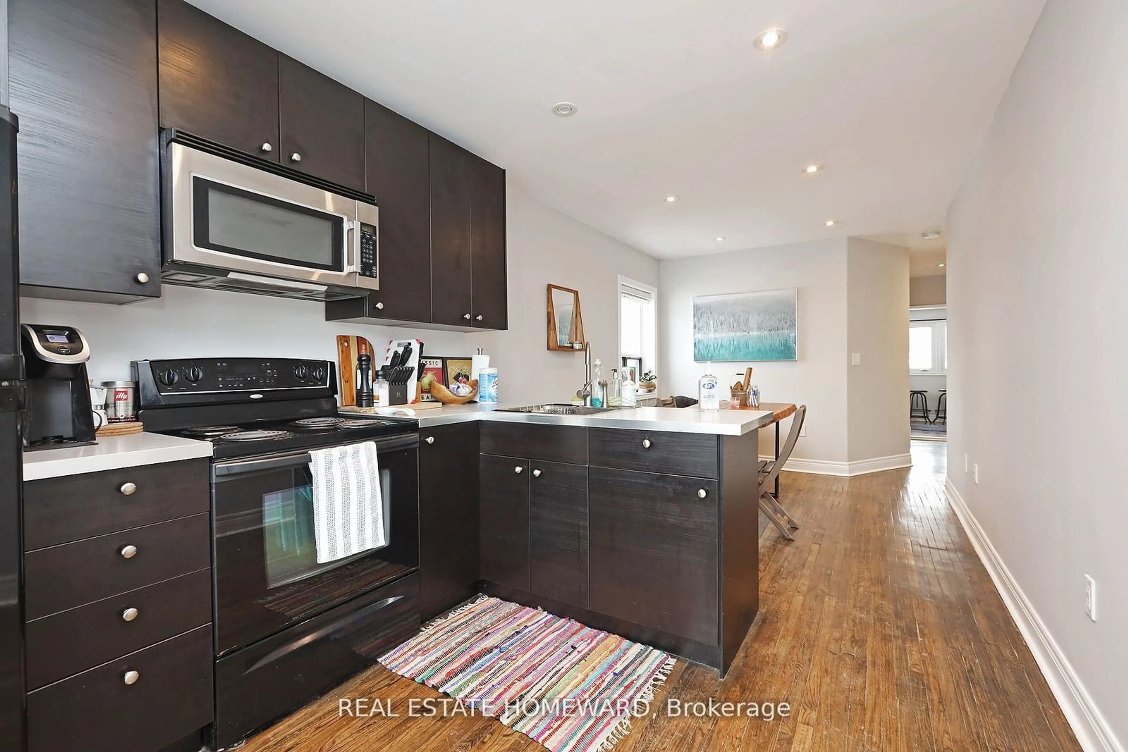 Open concept kitchen, wood/laminate floor for 156 Royal York Rd, Toronto Ontario M8V 2V3