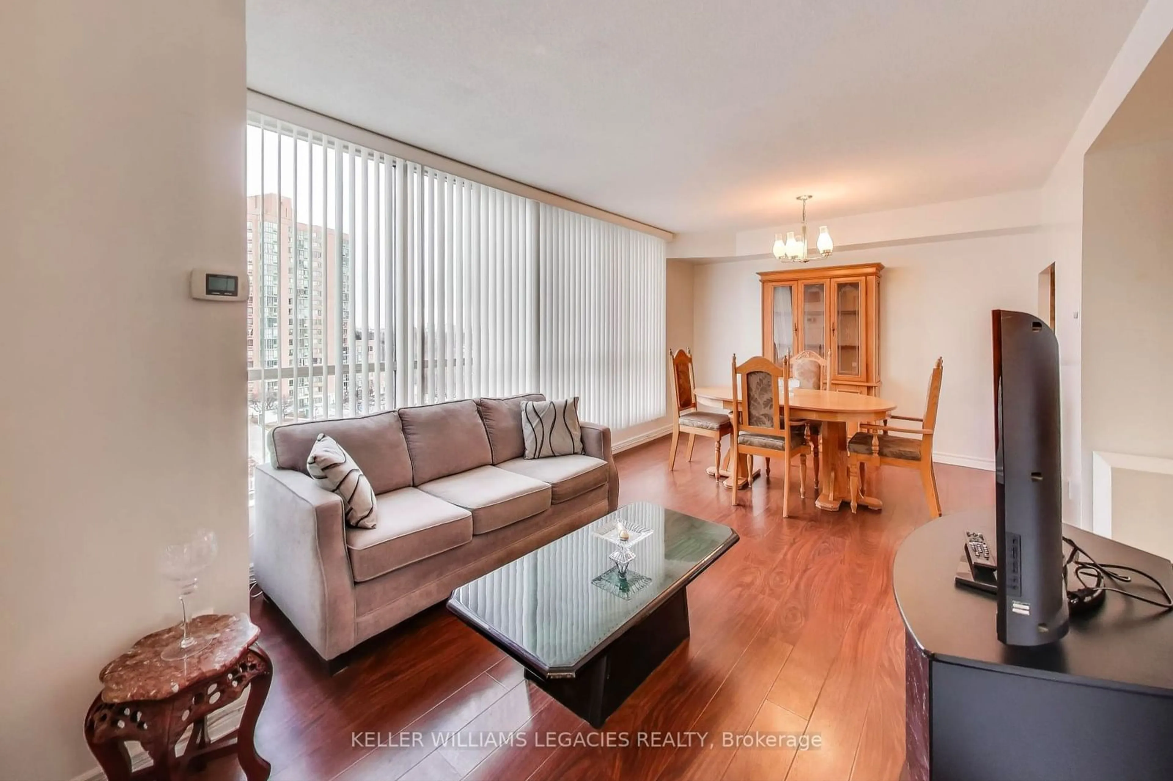 Living room with furniture, wood/laminate floor for 2901 Kipling Ave #801, Toronto Ontario M9V 5E5