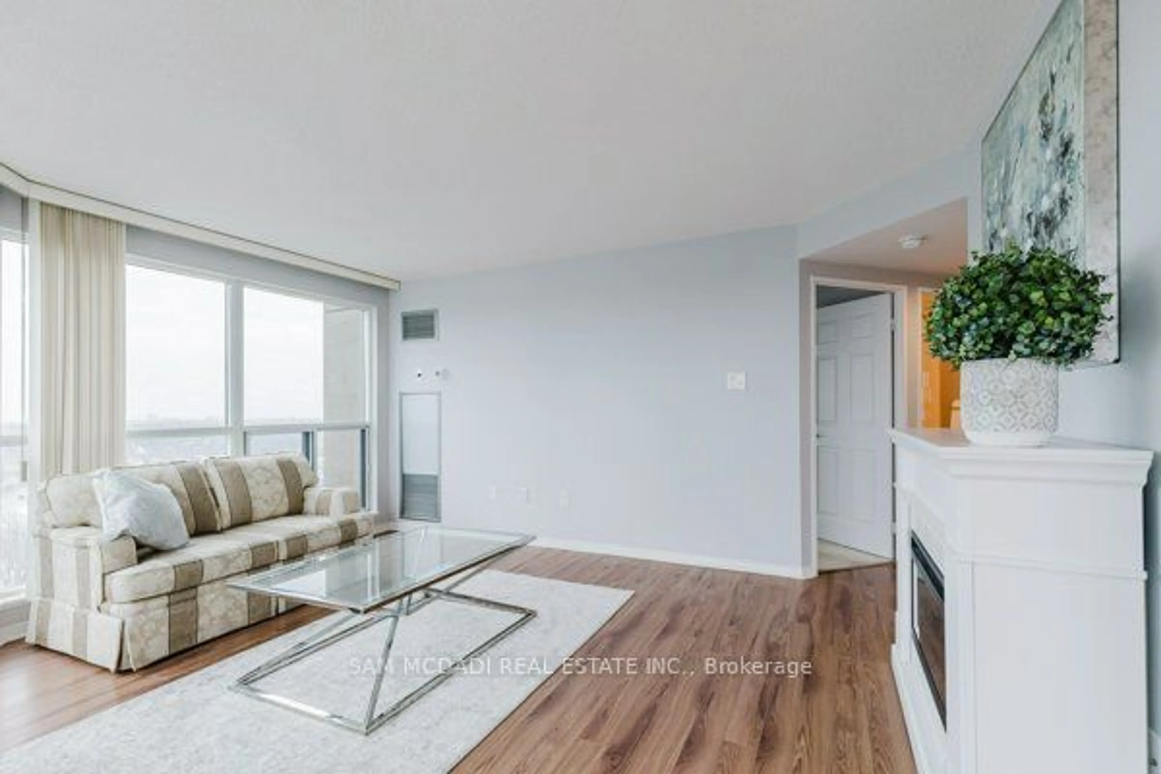 Living room with furniture, wood/laminate floor for 2177 Burnhamthorpe Rd #1309, Mississauga Ontario L5L 5P9