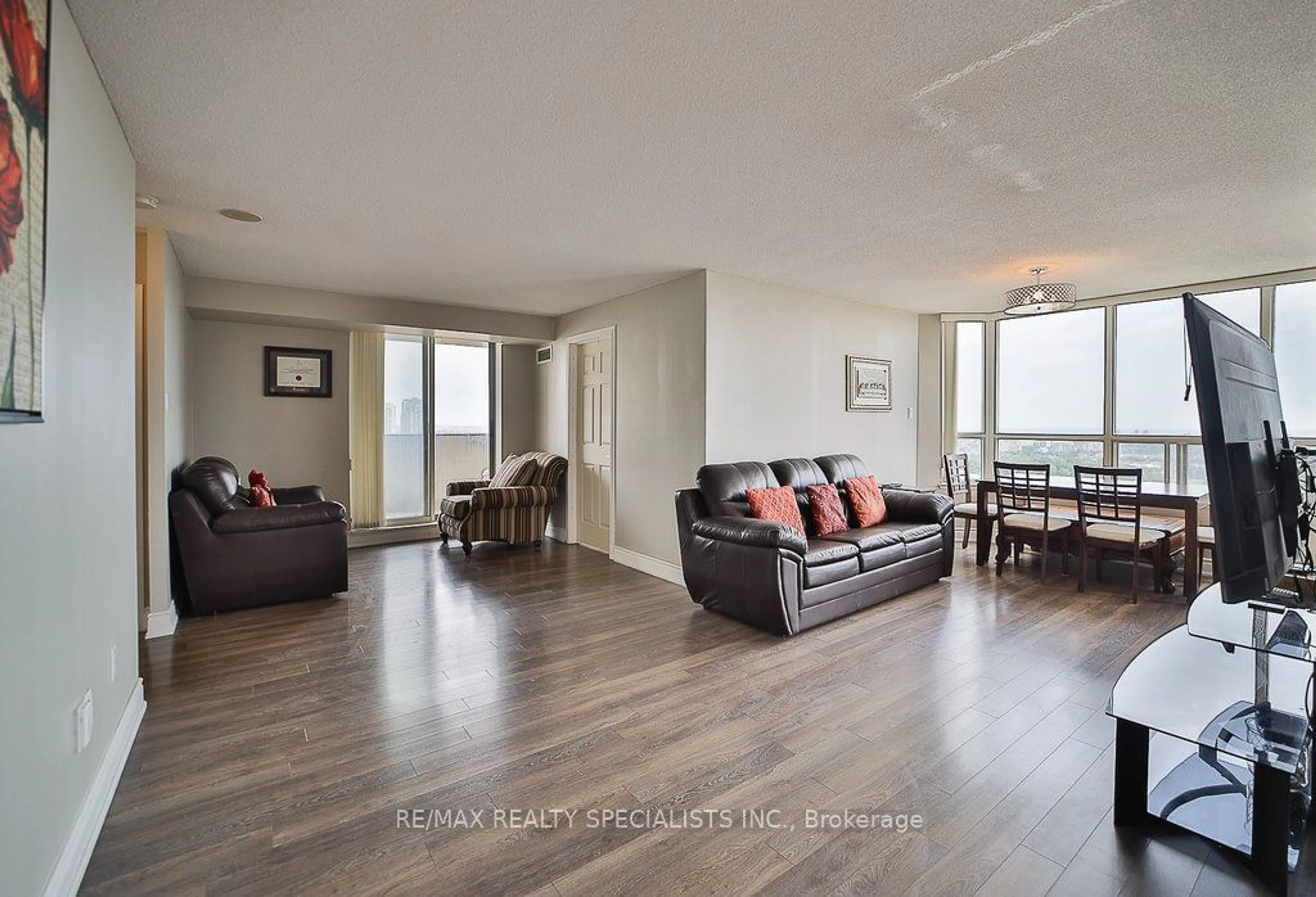 Living room with furniture, wood/laminate floor for 400 Webb Dr #2209, Mississauga Ontario L5B 3Z7