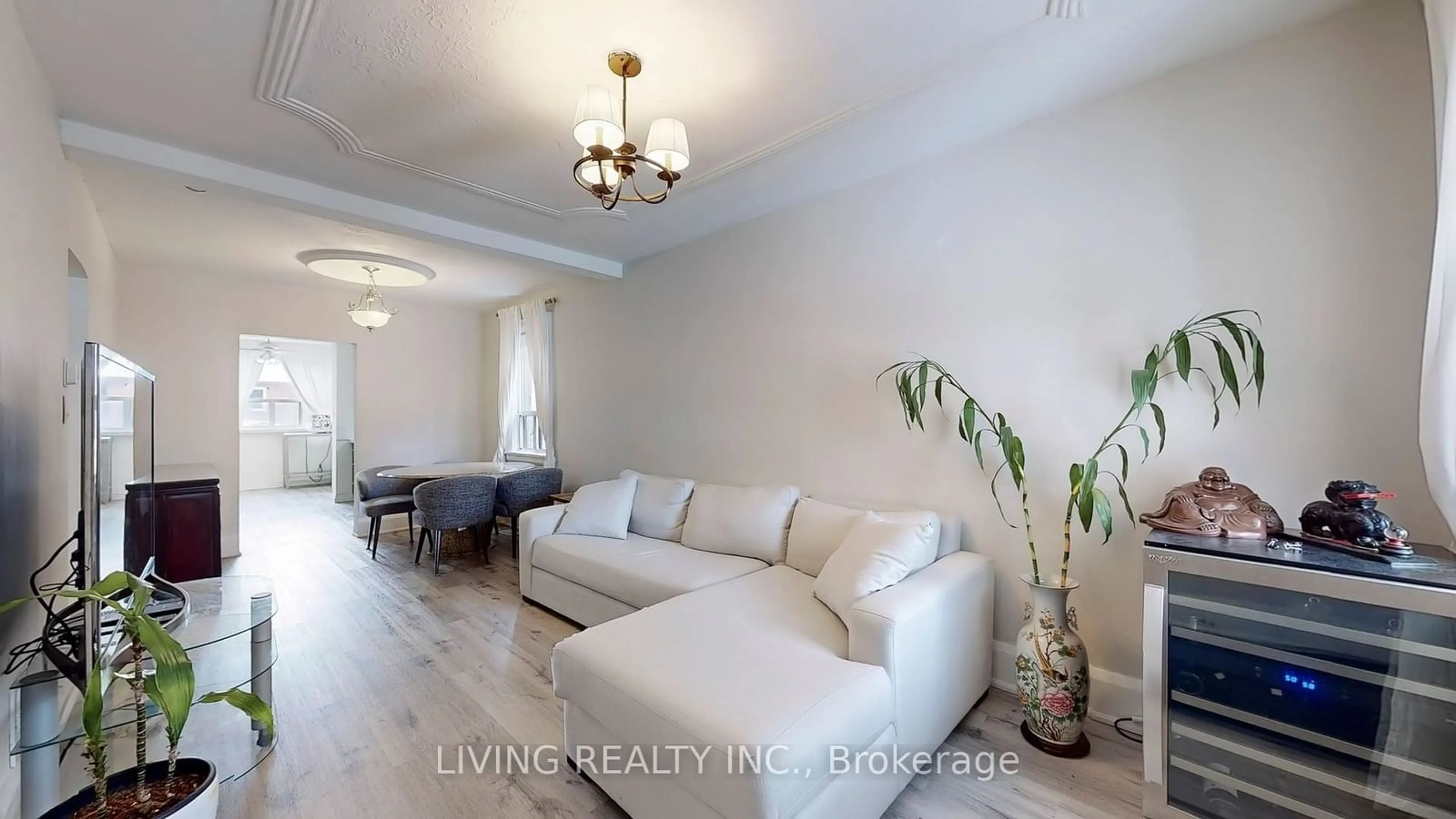 Living room with furniture, wood/laminate floor for 33 Bloem Ave, Toronto Ontario M6E 1S2