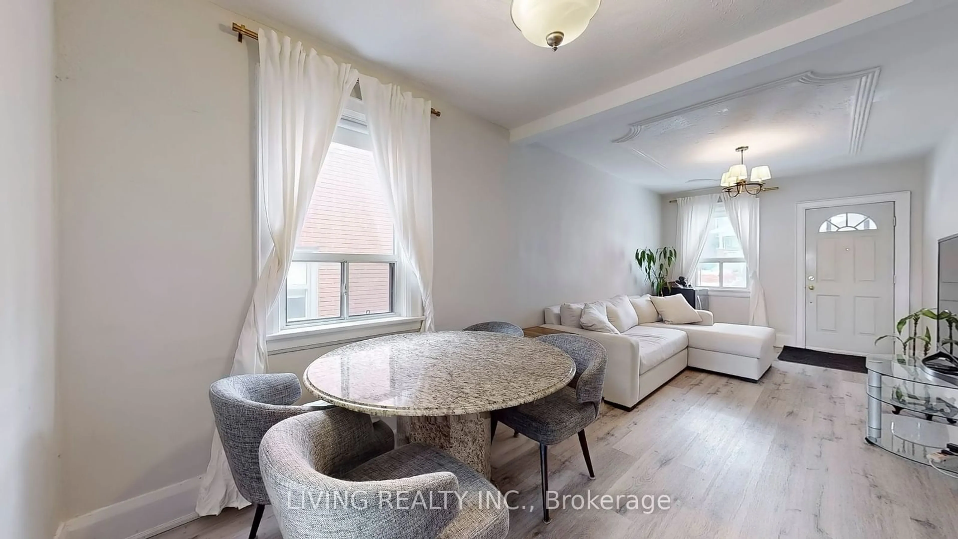 Living room with furniture, wood/laminate floor for 33 Bloem Ave, Toronto Ontario M6E 1S2