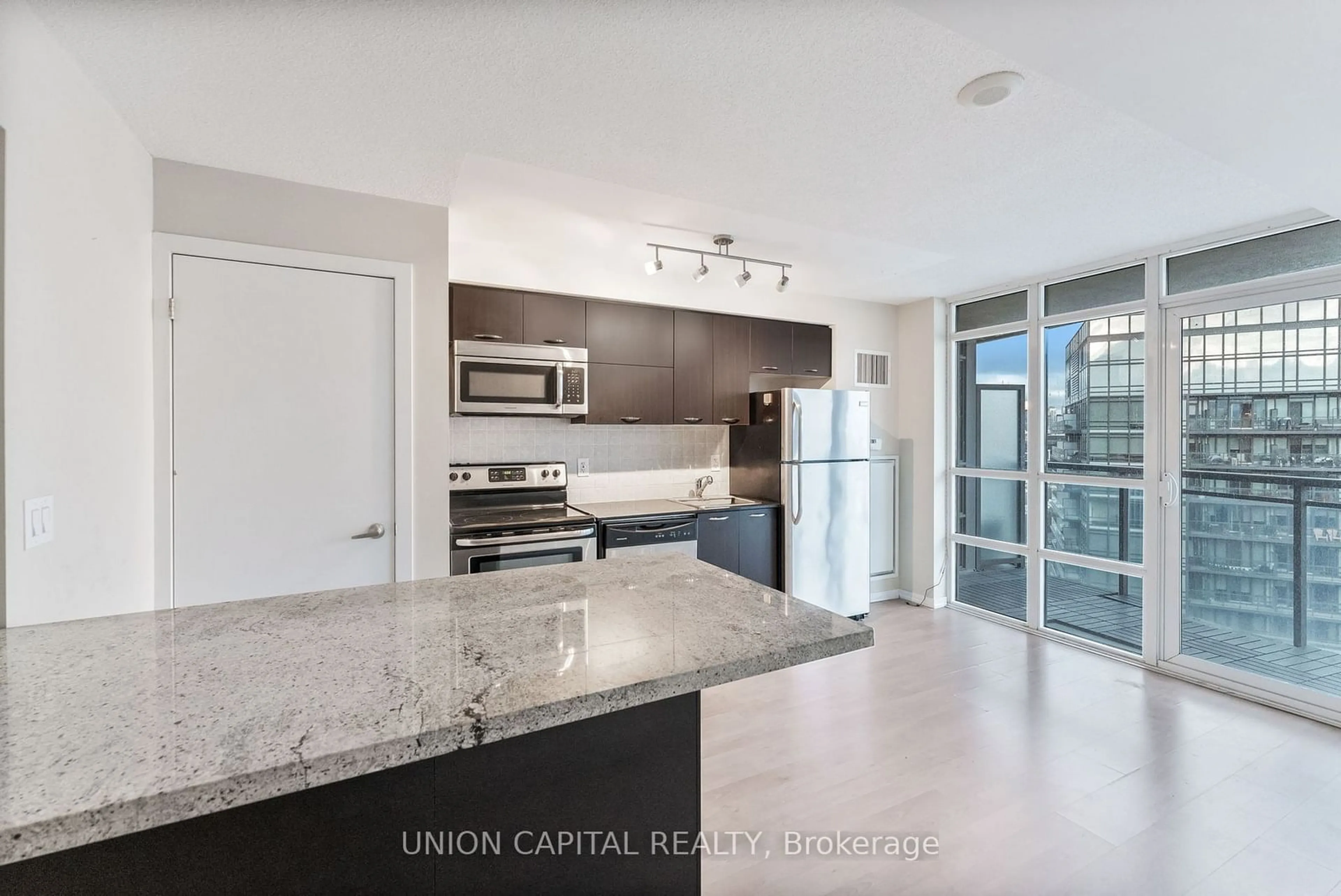 Open concept kitchen, unknown for 38 Joe Shuster Way #1801, Toronto Ontario M6K 0A5