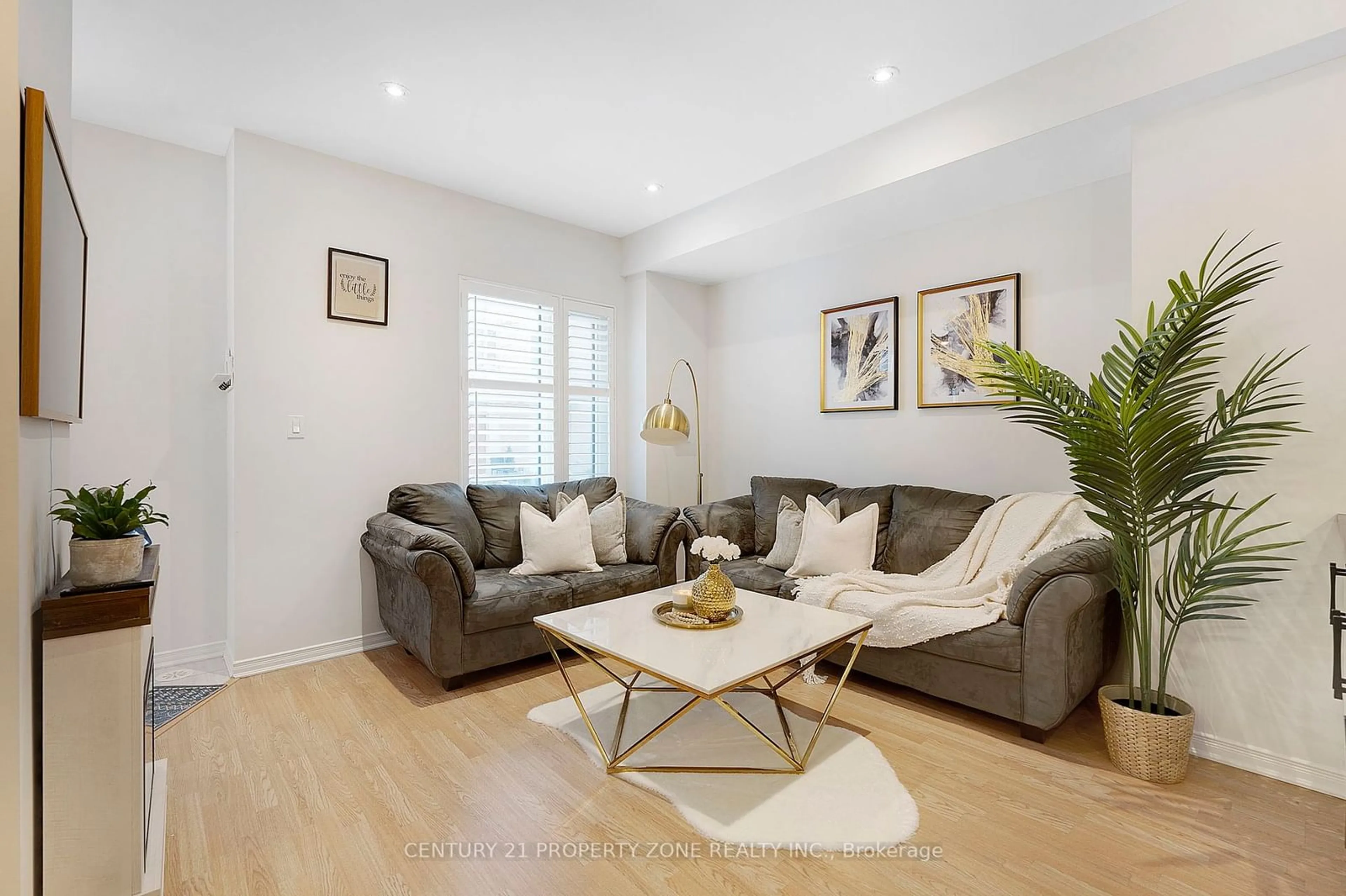 Living room with furniture, wood/laminate floor for 18 Applewood Lane #24, Toronto Ontario M9C 0C1