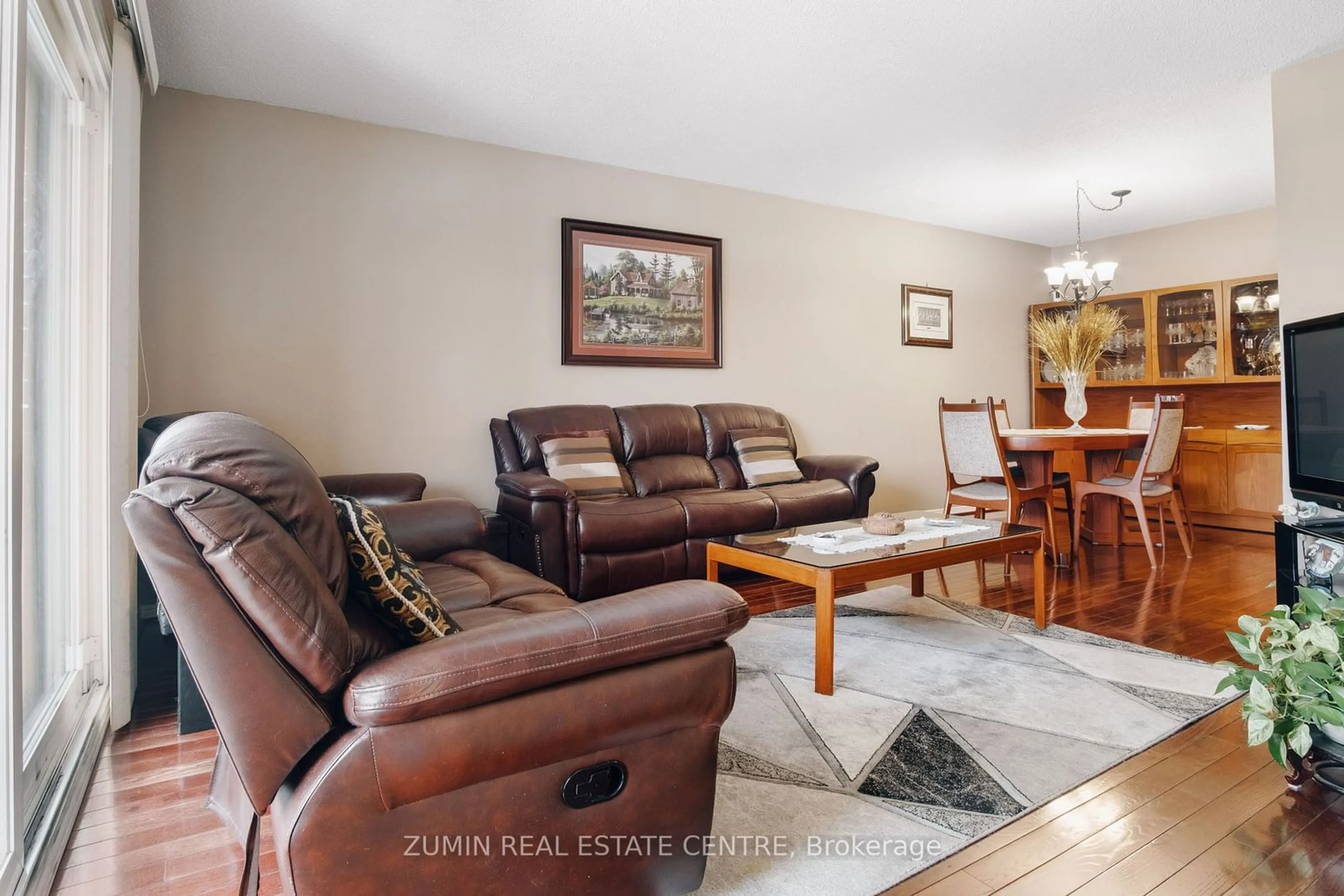 Living room with furniture, wood/laminate floor for 77 Bordeaux Crct, Toronto Ontario M9V 4Y9