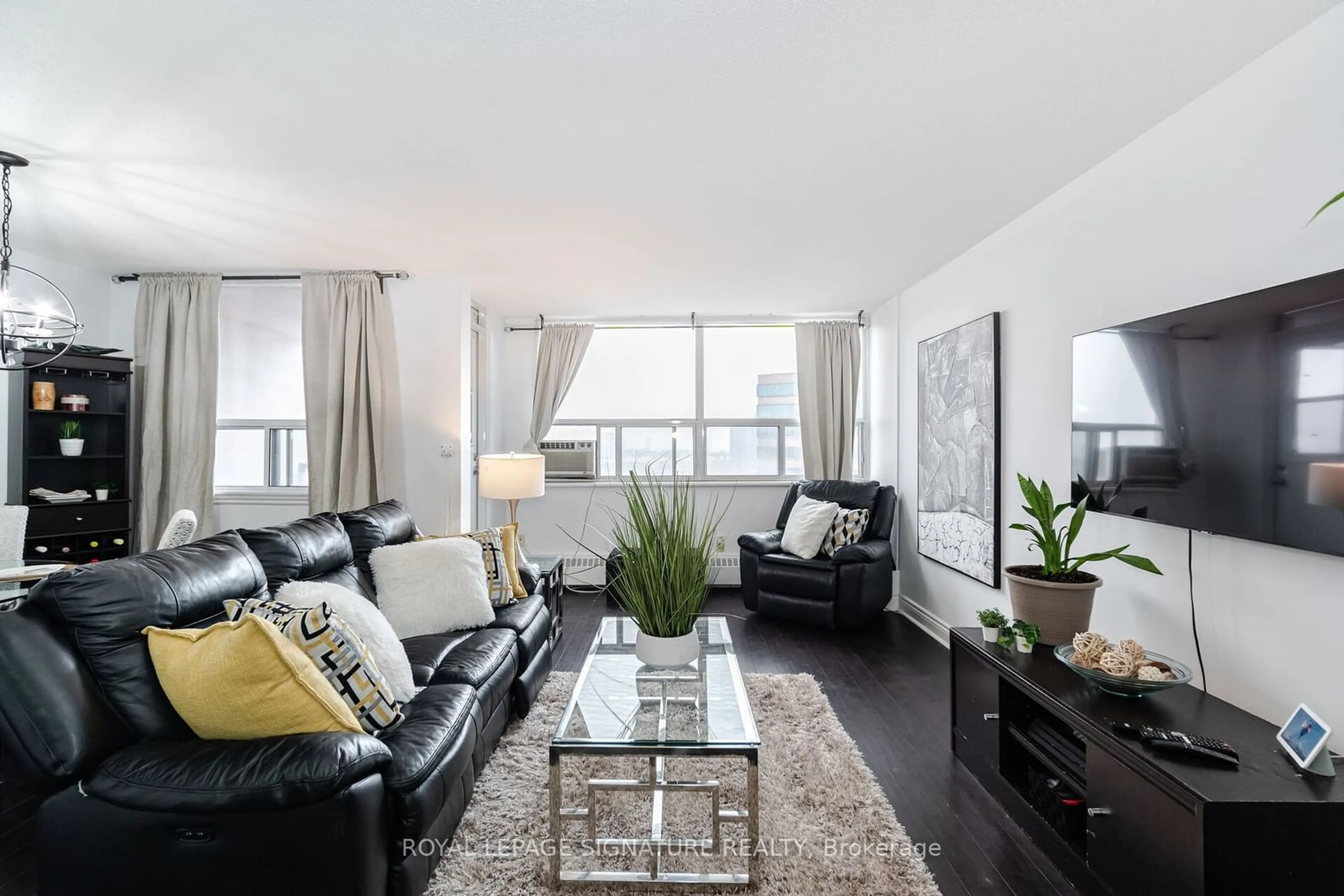 Living room with furniture, wood/laminate floor for 451 The West Mall Dr #1212, Toronto Ontario M9C 1G1