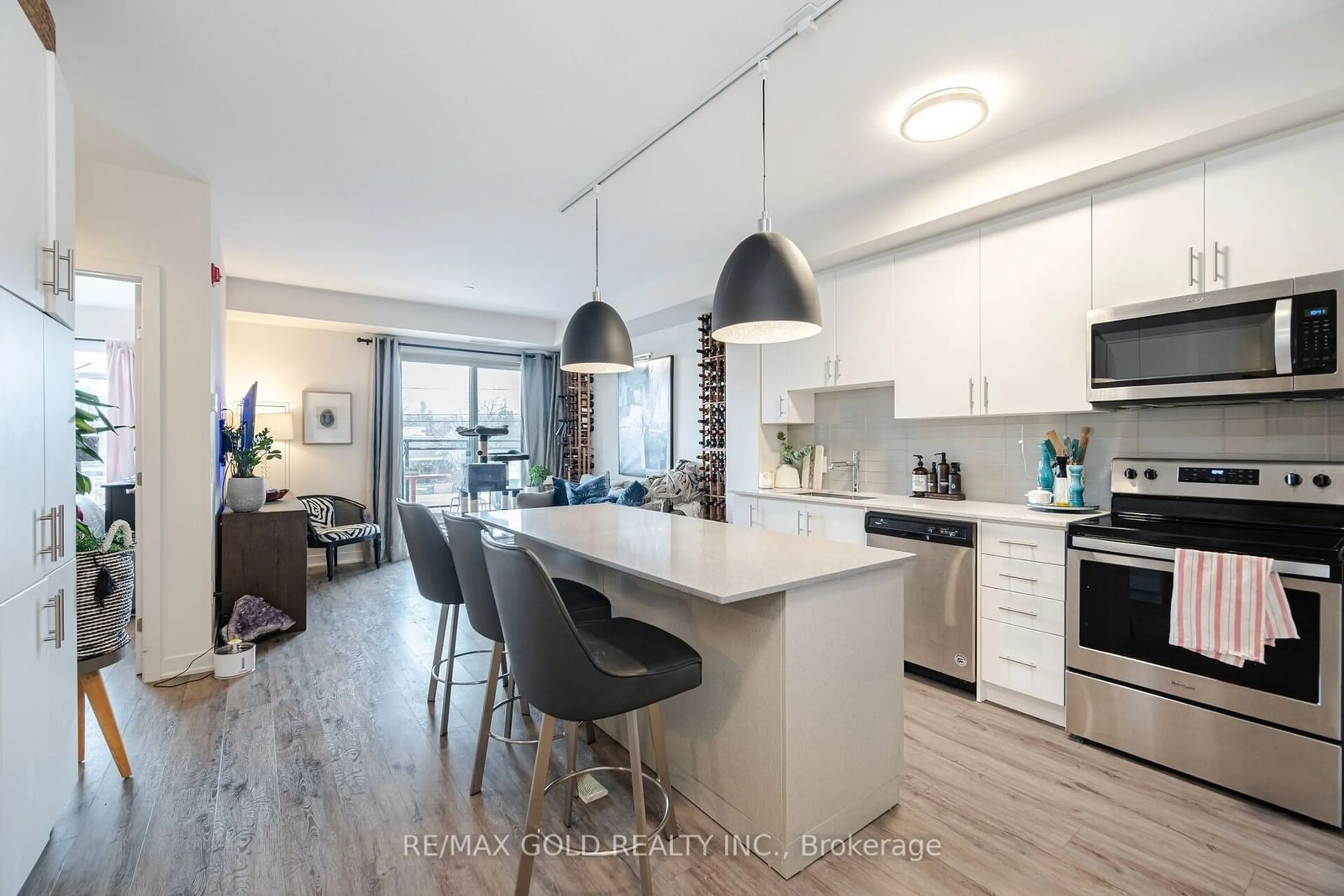 Open concept kitchen, wood/laminate floor for 320 Plains Rd #213, Burlington Ontario L7T 0C1