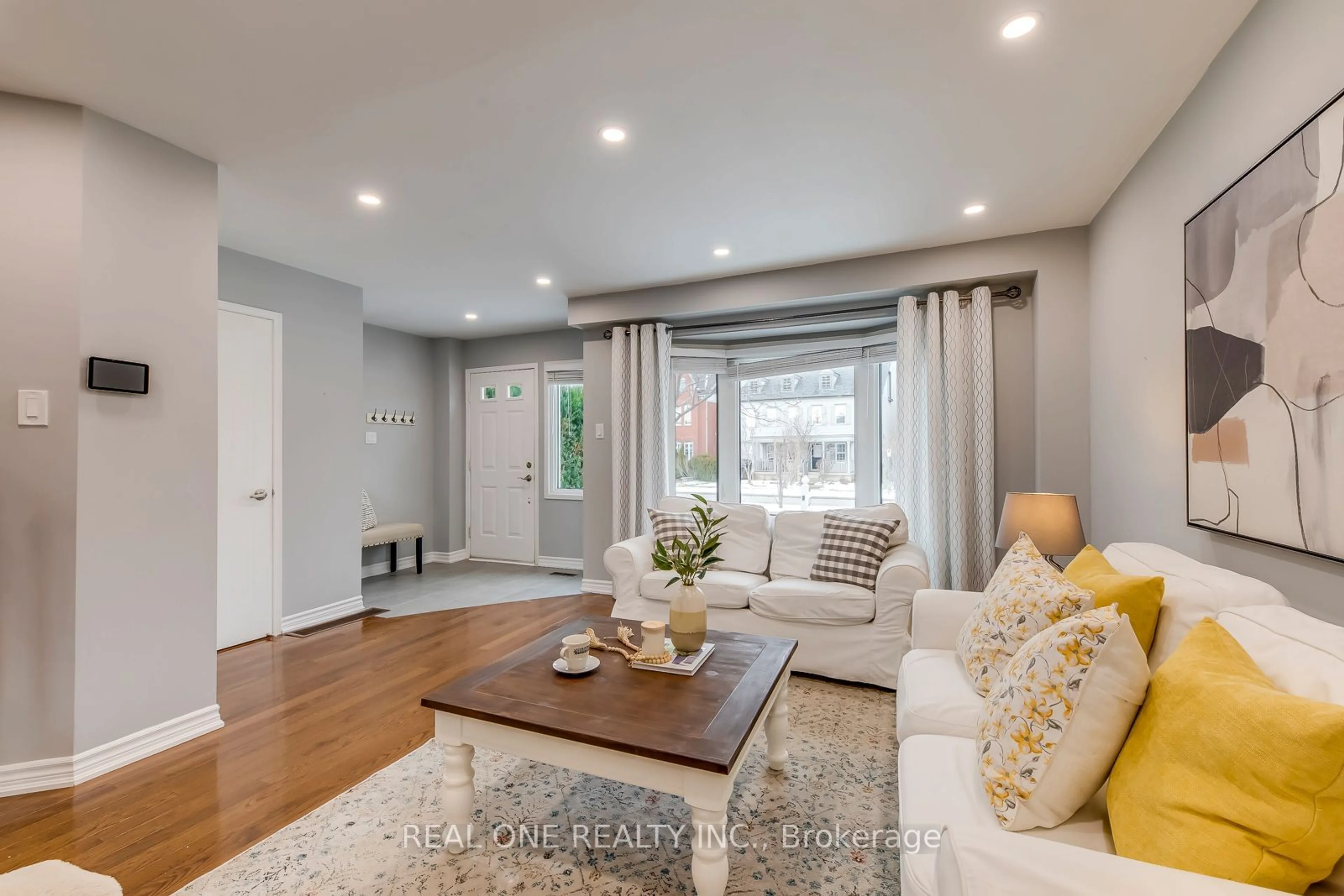 Living room with furniture, wood/laminate floor for 70 Glenashton Dr, Oakville Ontario L6H 6G2