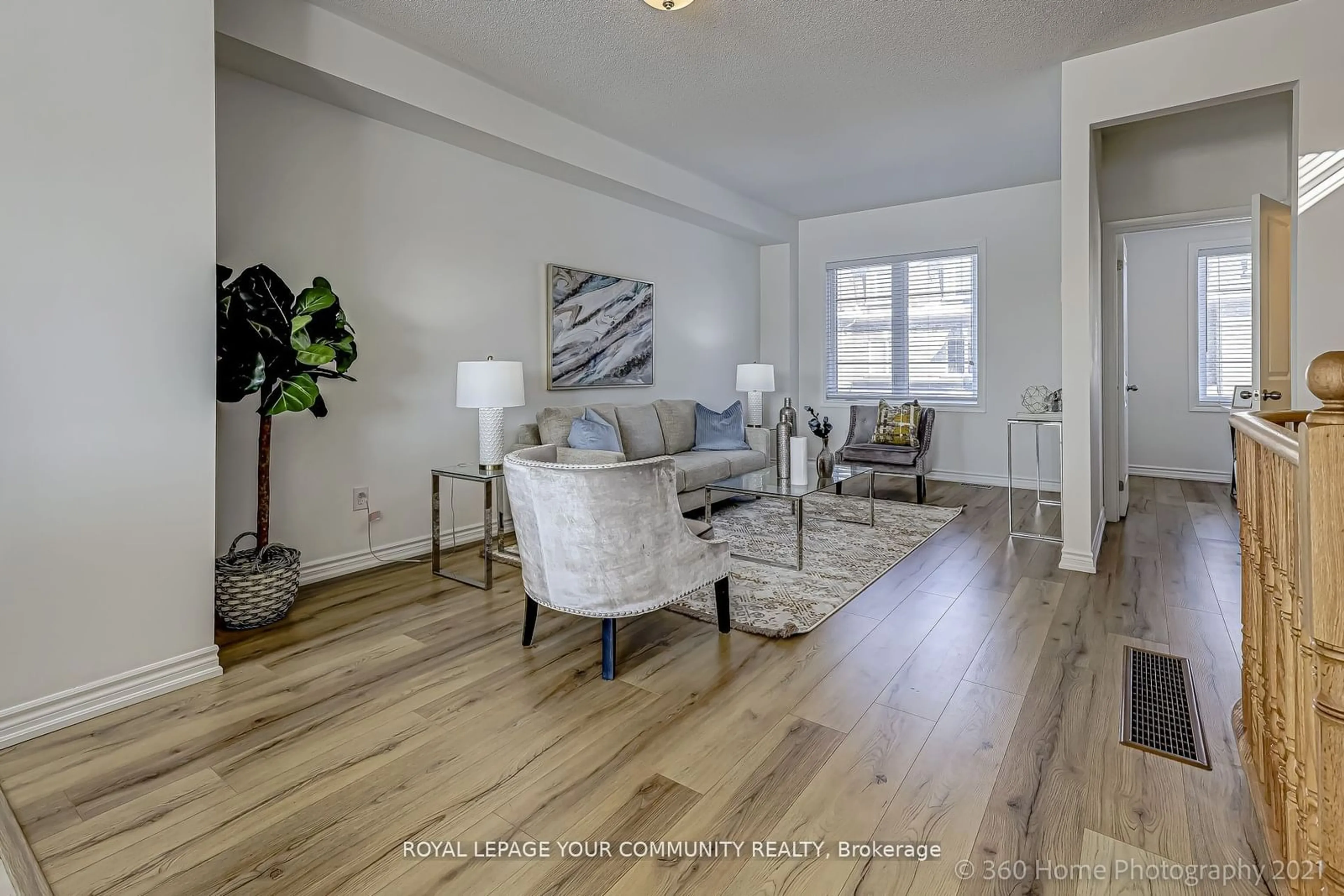 Living room with furniture, wood/laminate floor for 8 Pomarine Way, Brampton Ontario L6X 0E4