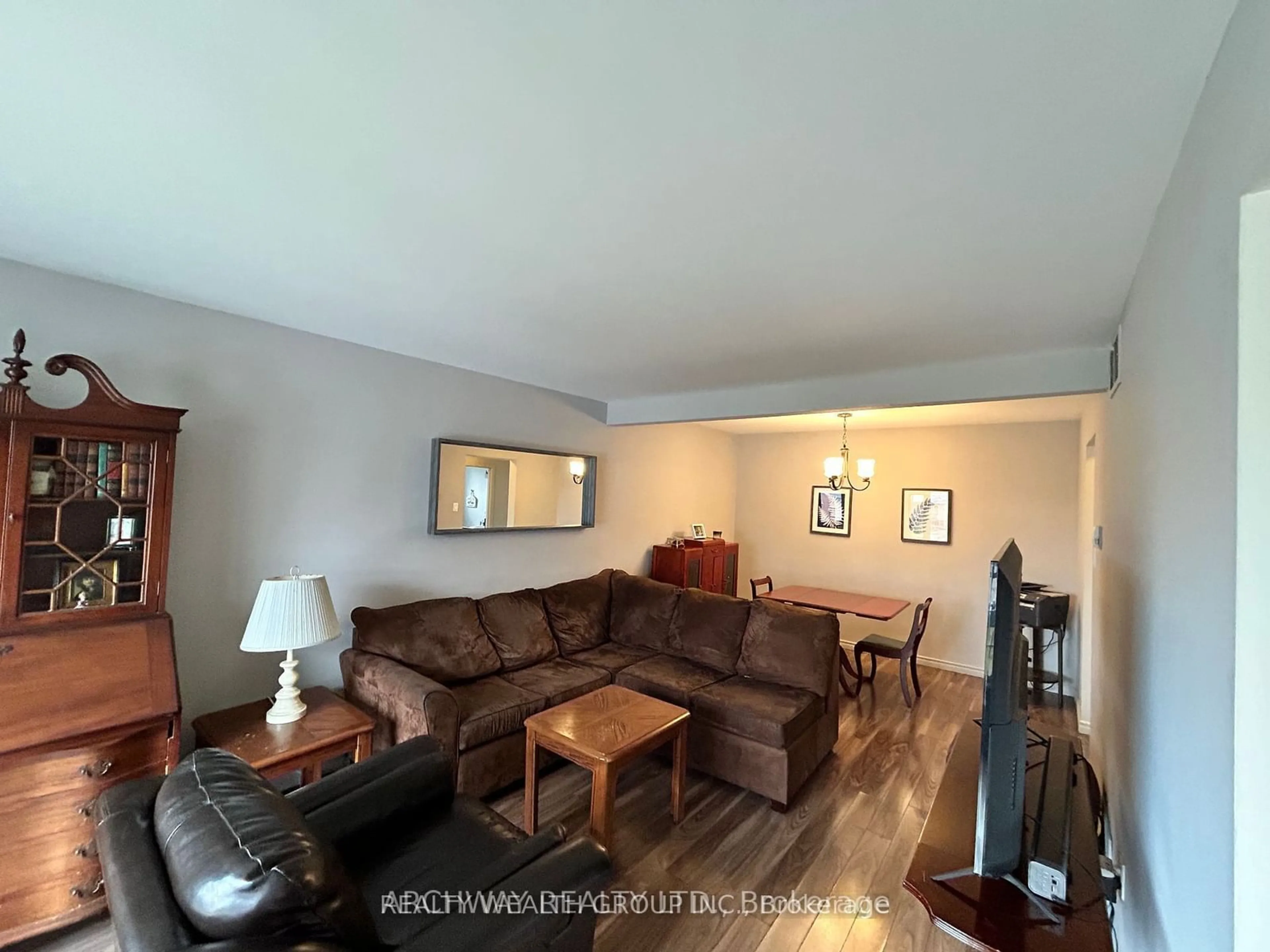 Living room with furniture, wood/laminate floor for 16 Sharon Crt, Brampton Ontario L6W 3B7