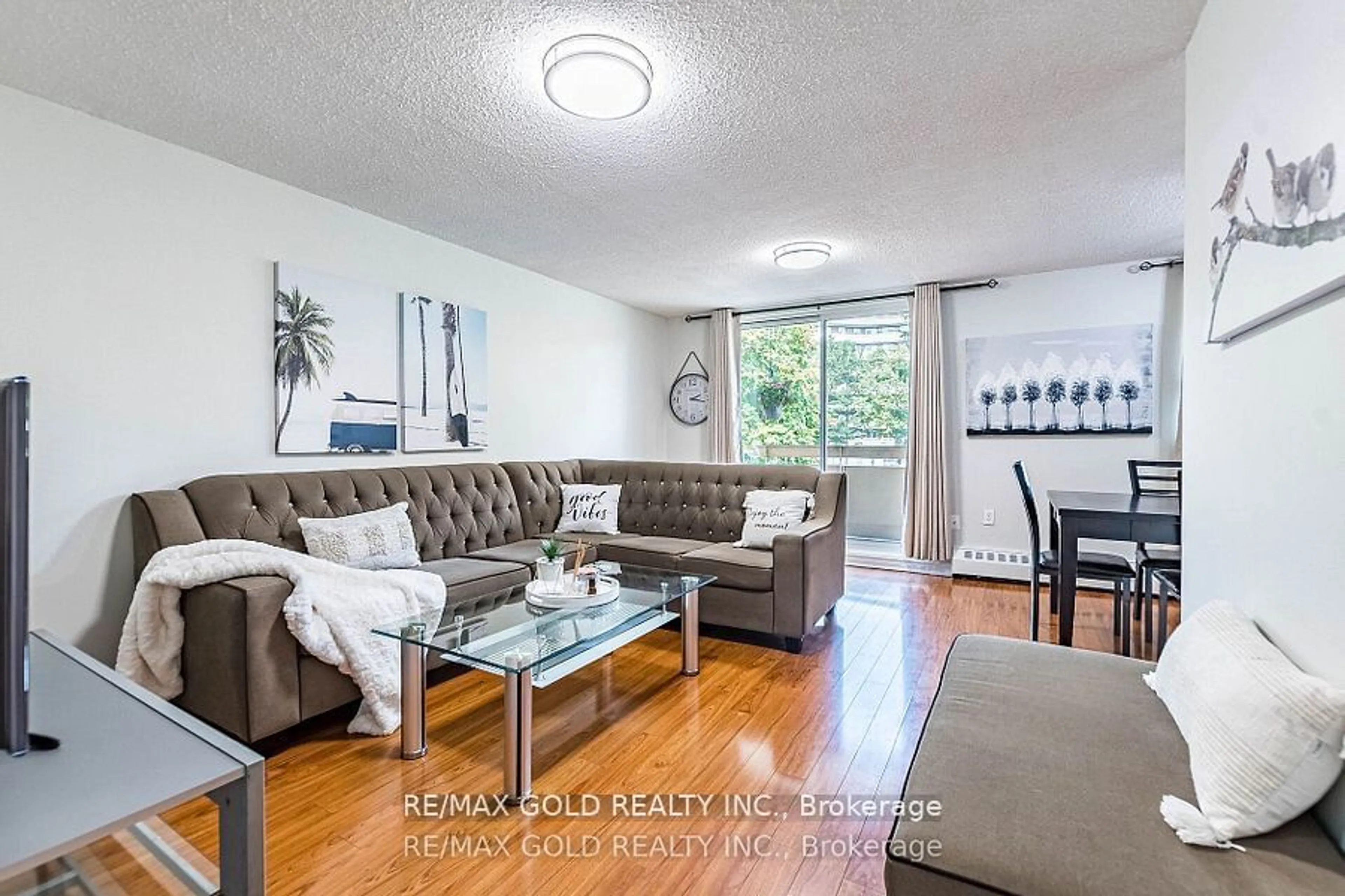 Living room with furniture, wood/laminate floor for 3555 Derry Rd #209, Mississauga Ontario L4T 1B2