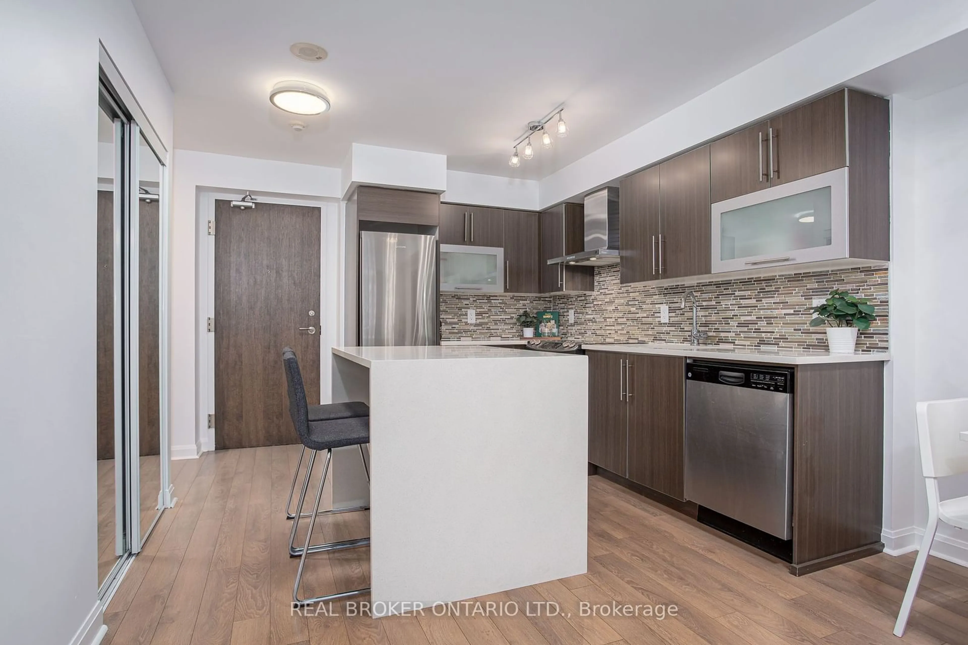 Open concept kitchen, wood/laminate floor for 1 Michael Power Pl #1603, Toronto Ontario M9A 0A1