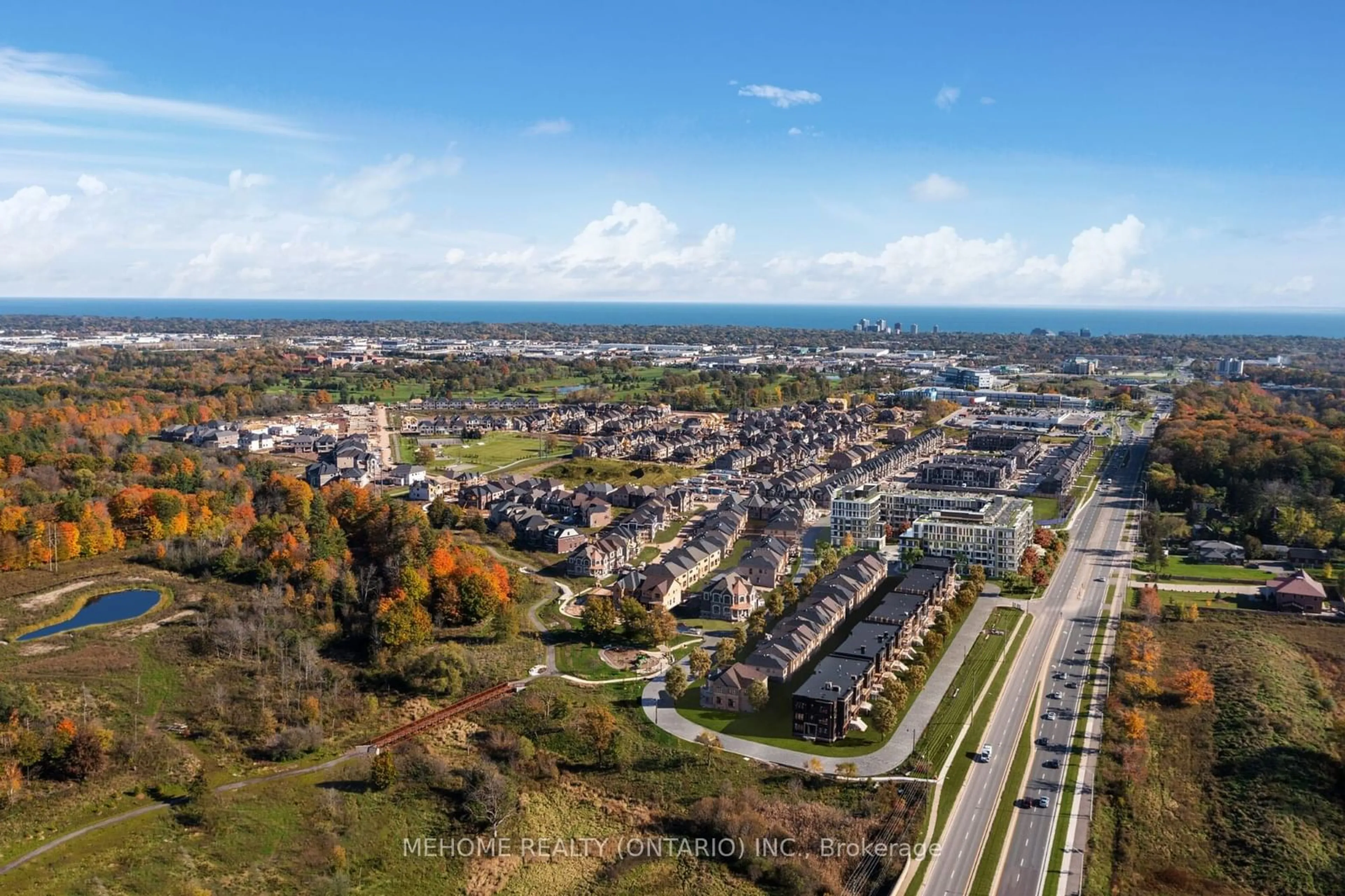 A pic from outside/outdoor area/front of a property/back of a property/a pic from drone, street for 2501 SAW WHET Blvd #311, Oakville Ontario L6M 5N2