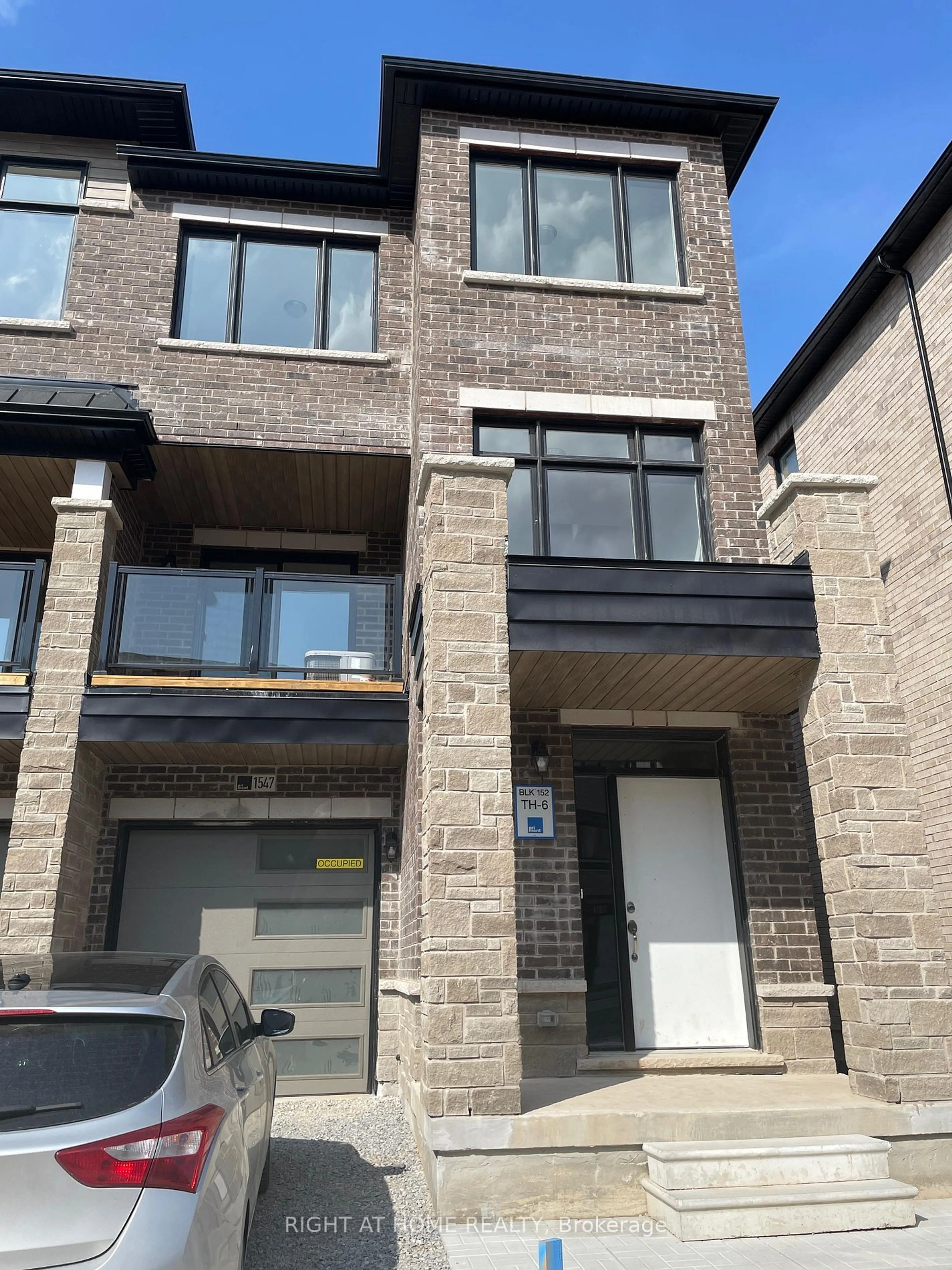 Home with brick exterior material, street for 1547 Moonseed Pl, Milton Ontario L9E 1V4