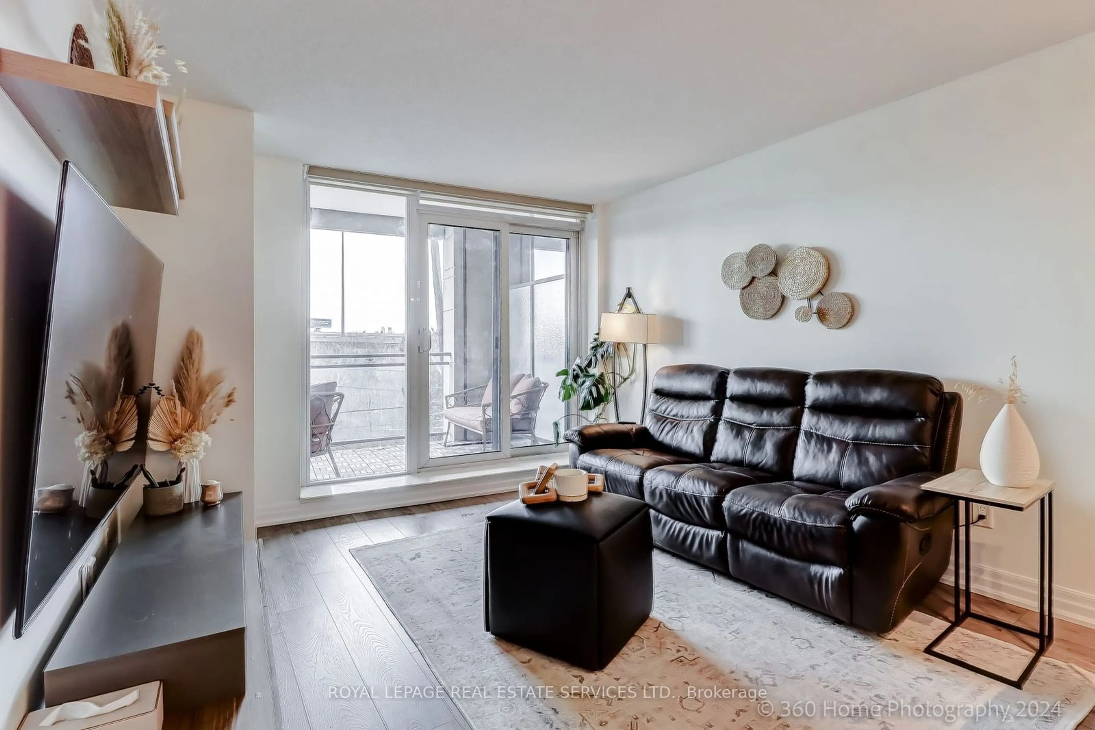 Living room with furniture, wood/laminate floor for 2121 Lakeshore Blvd #403, Toronto Ontario M8V 4E9