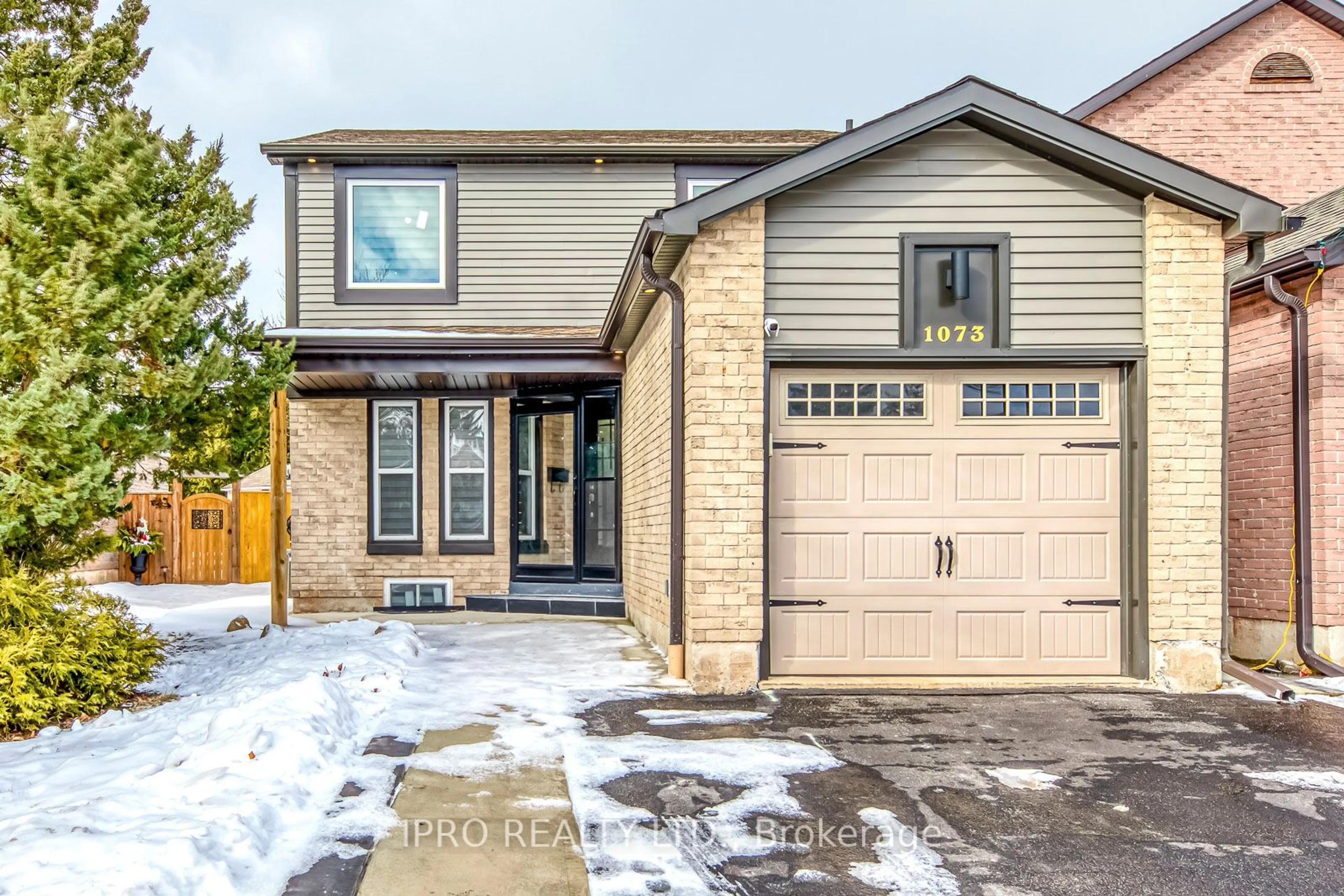 Home with brick exterior material, street for 1073 Montgomery Dr, Oakville Ontario L6M 1E8