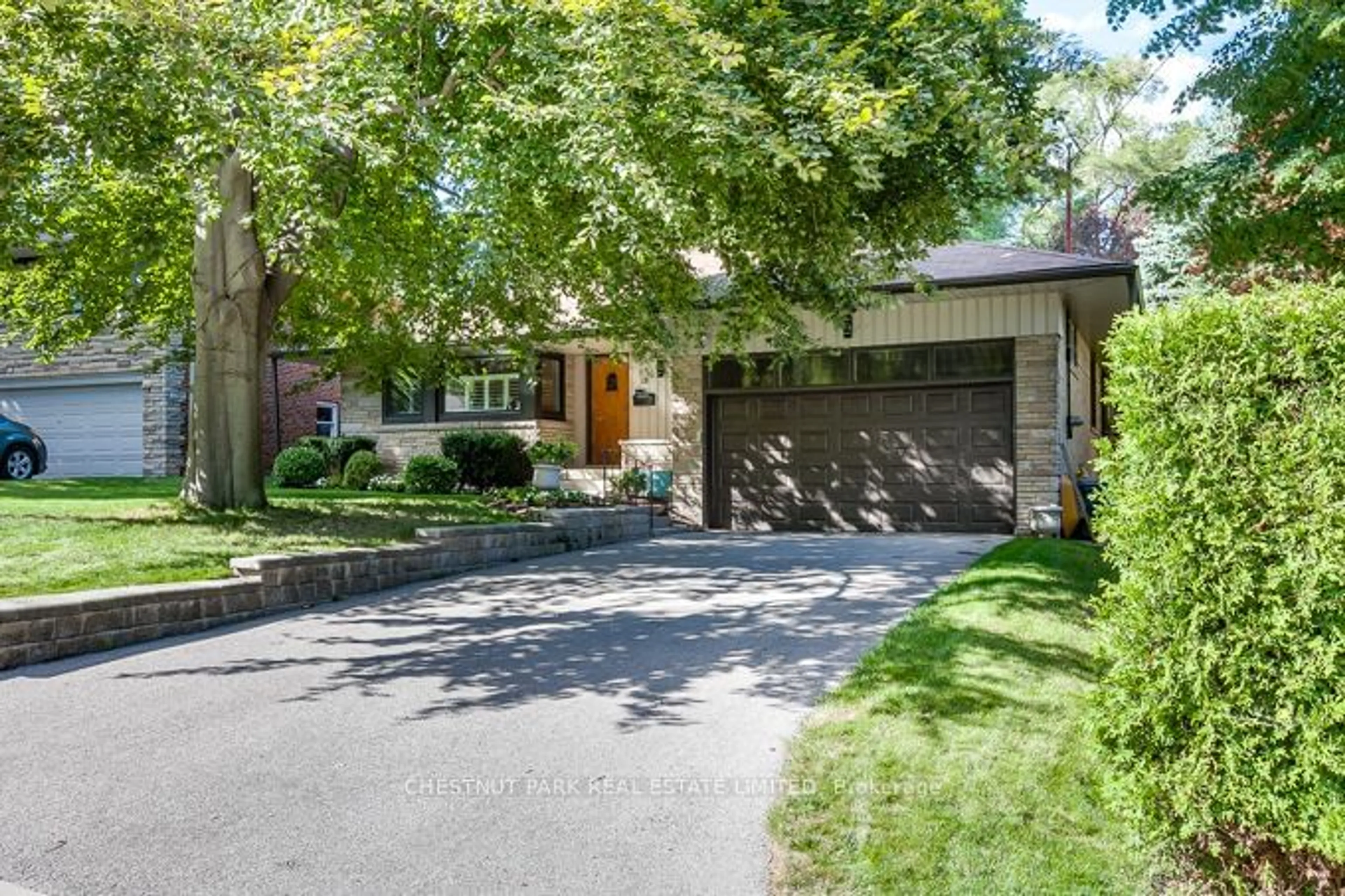 Home with brick exterior material, street for 18 Woodway Tr, Toronto Ontario M8Y 2B8