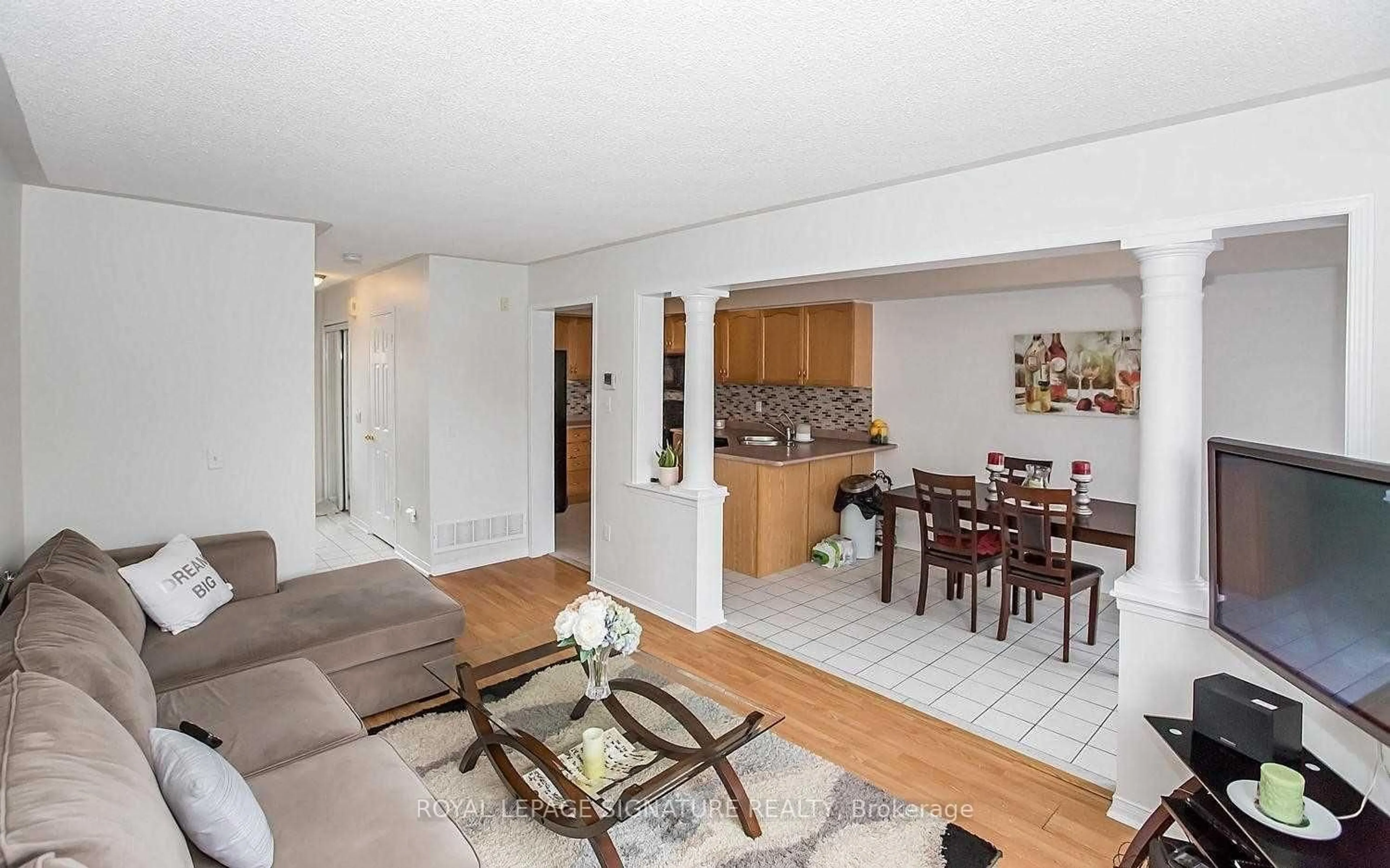 Living room with furniture, wood/laminate floor for 9900 Mclaughlin Rd #35, Brampton Ontario L6X 4Y3