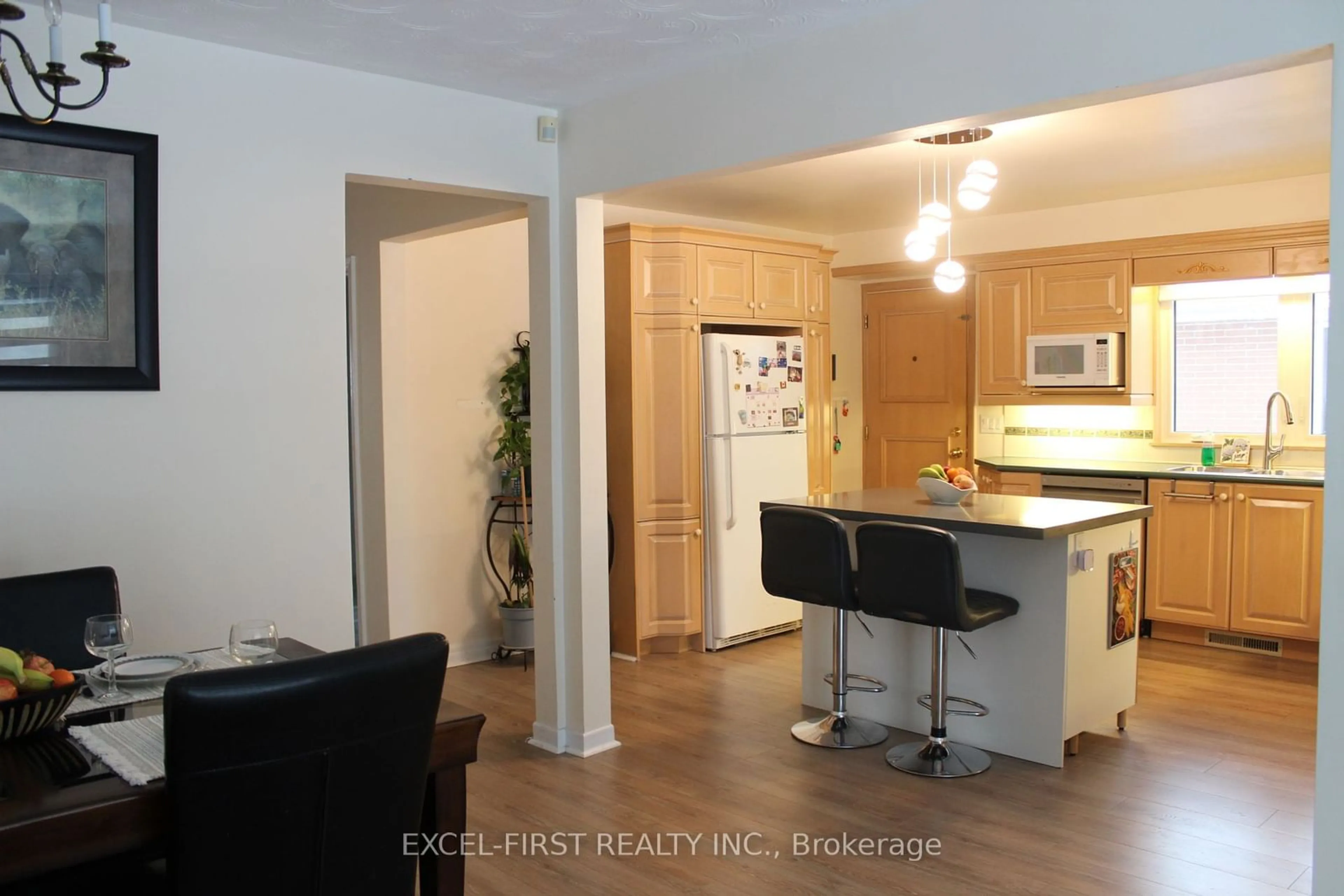 Open concept kitchen, wood/laminate floor for 215 Thistle Down Blvd, Toronto Ontario M9V 1K4