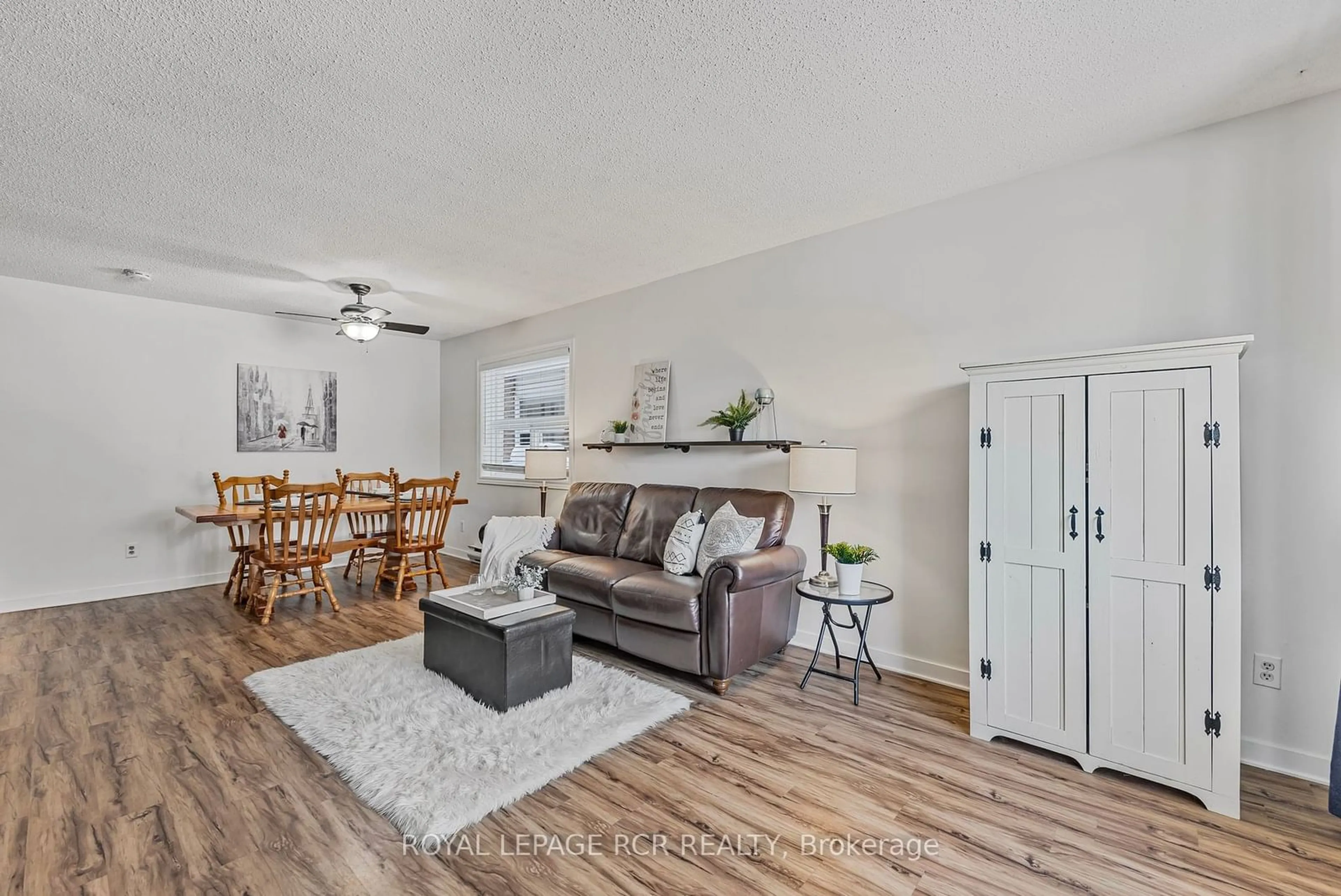 Living room with furniture, wood/laminate floor for 90 Lawrence Ave #82, Orangeville Ontario L9W 4J3