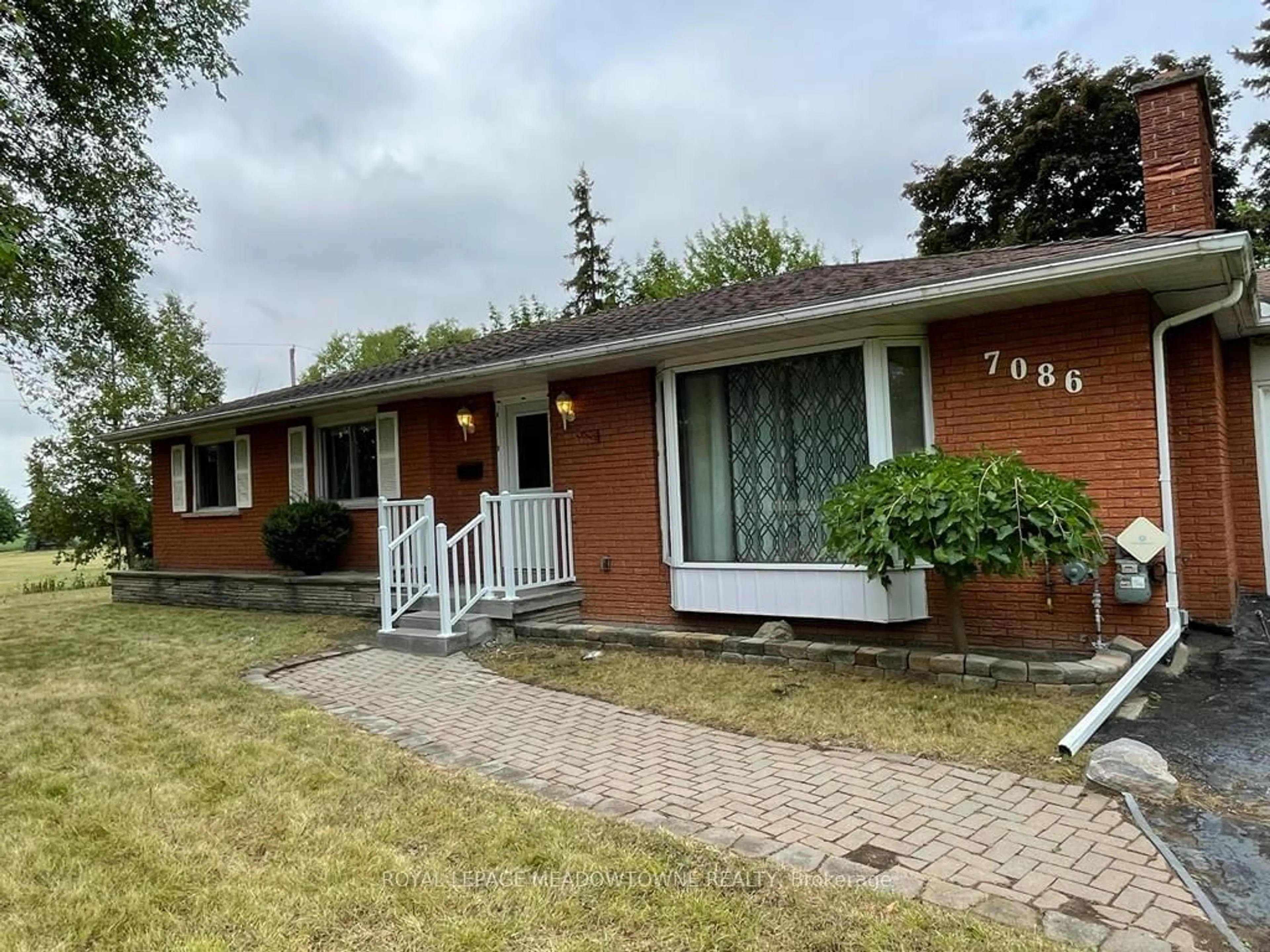 Home with brick exterior material, street for 7086 Tremaine Rd, Milton Ontario L9E 1A9