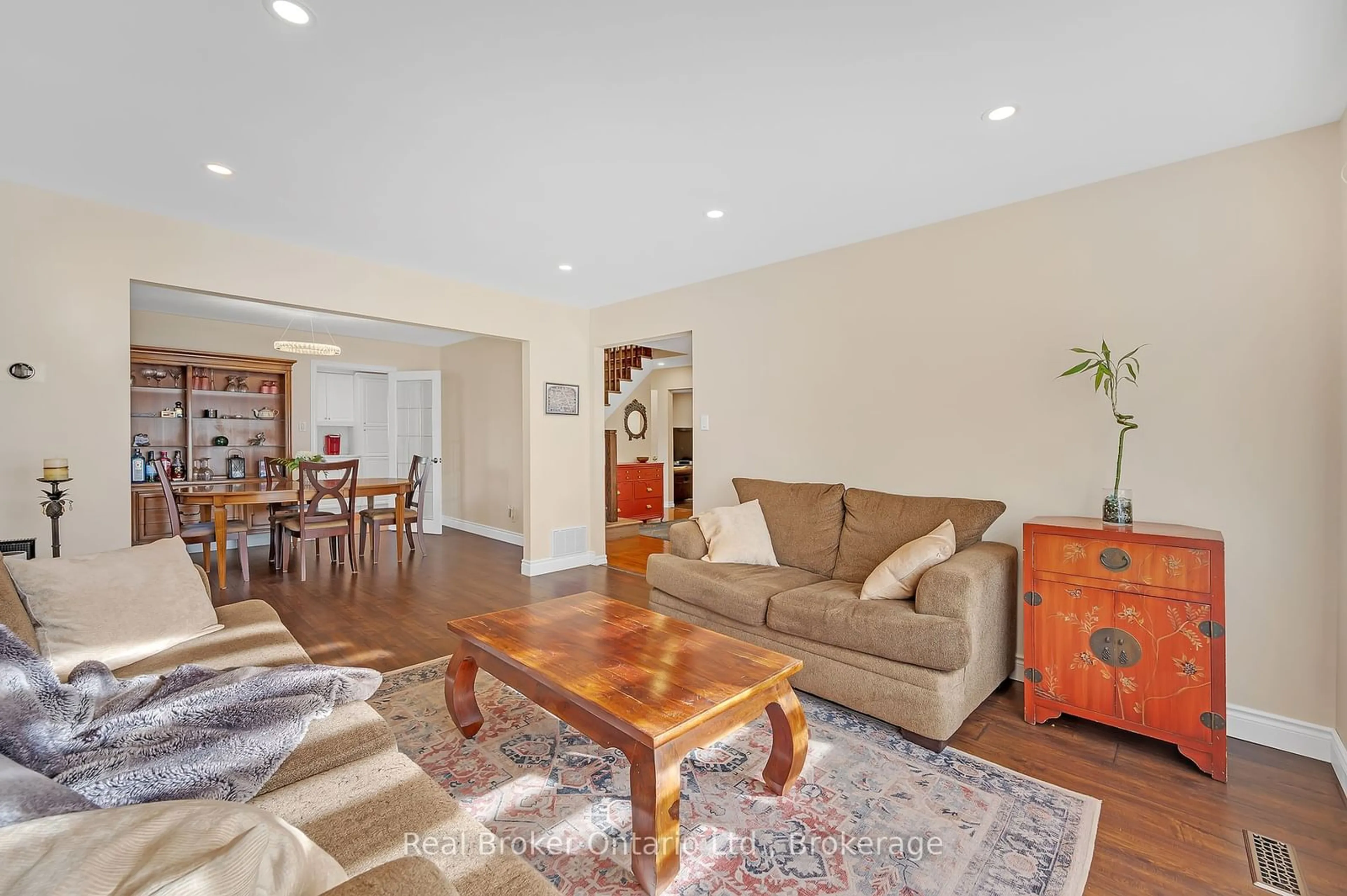 Living room with furniture, wood/laminate floor for 2503 Waterford St, Oakville Ontario L6L 5E5