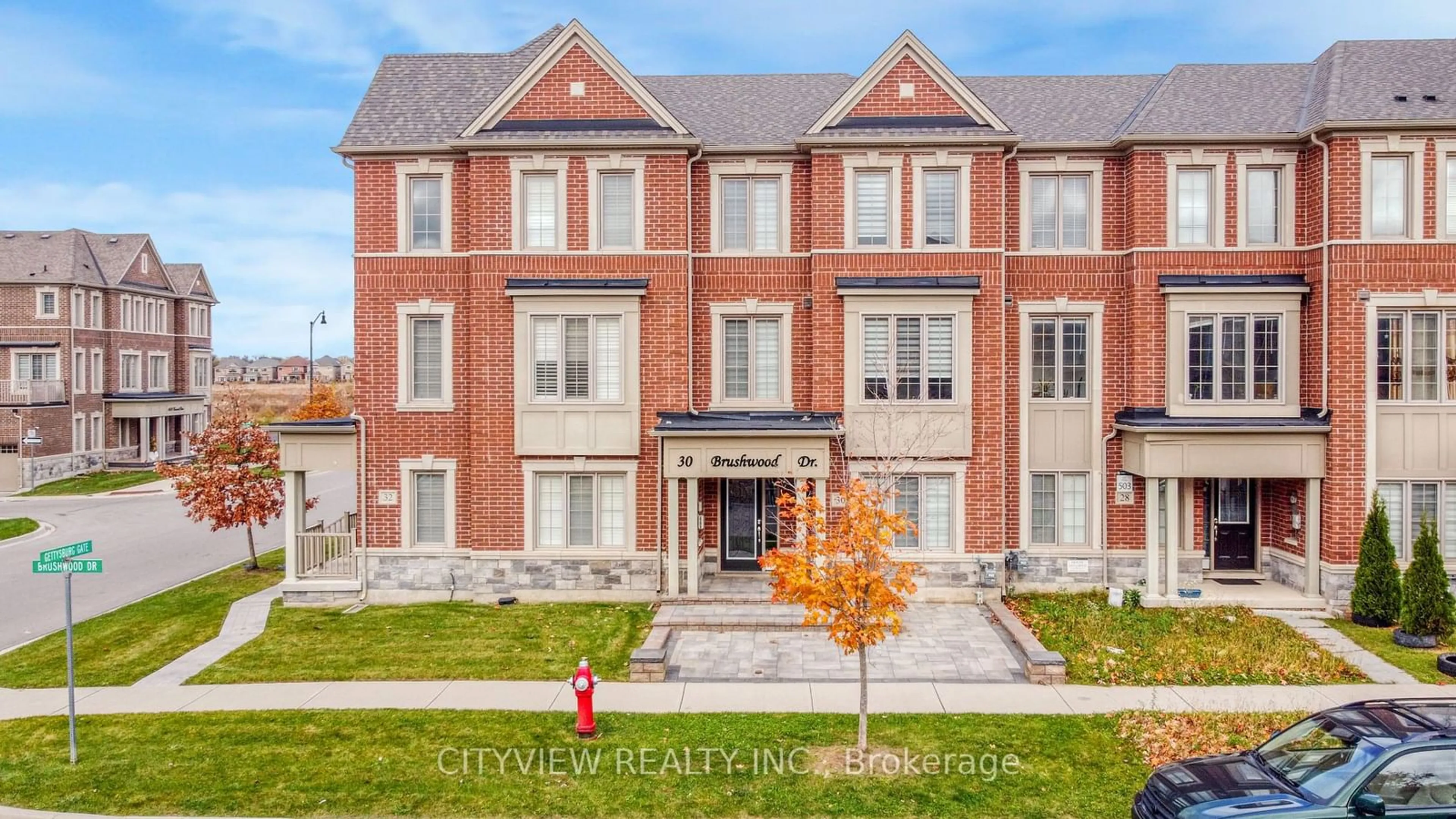 Home with brick exterior material, street for 30 Brushwood Dr, Brampton Ontario L6Y 0E3